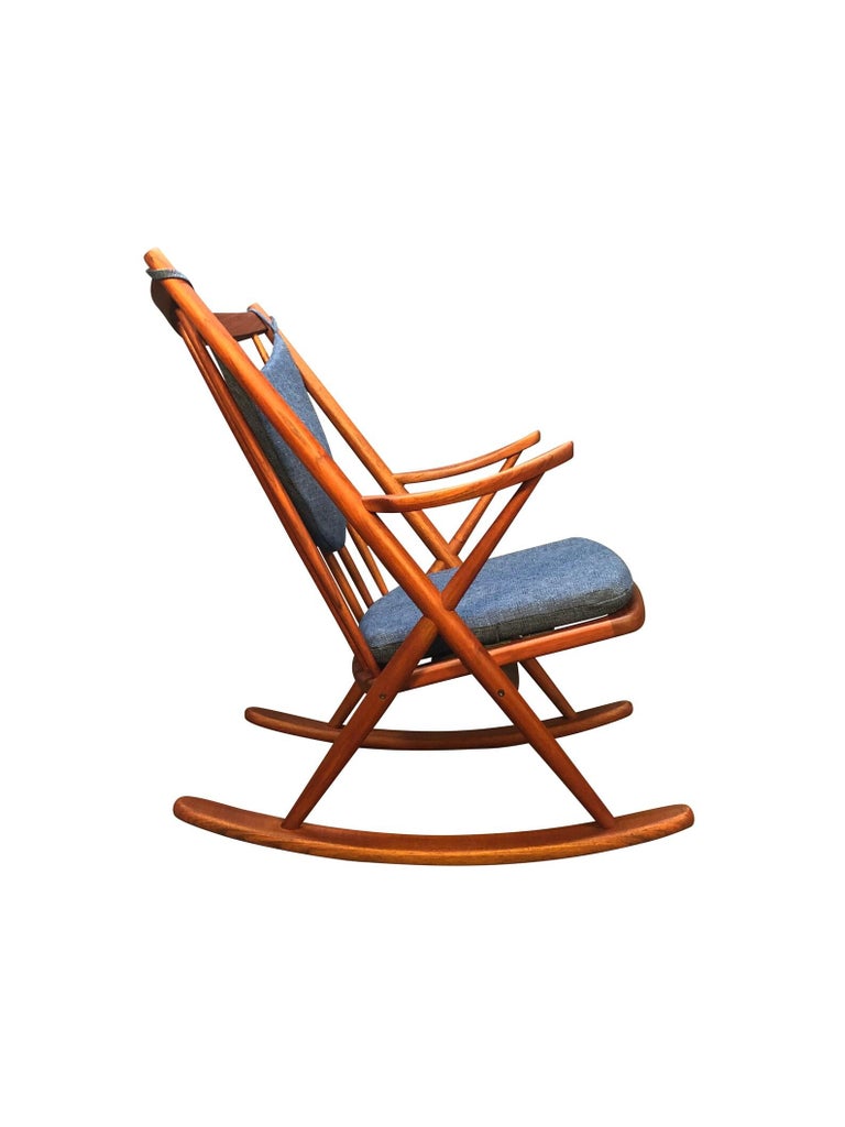 Beautiful Danish modern teak rocking chair designed by Frank Reenskaug and manufactured by Bramin Mobelfabrik in Denmark in the 1960's.

This comfortable rocking chair features a sculptural solid teak frame that has been completely refinished and