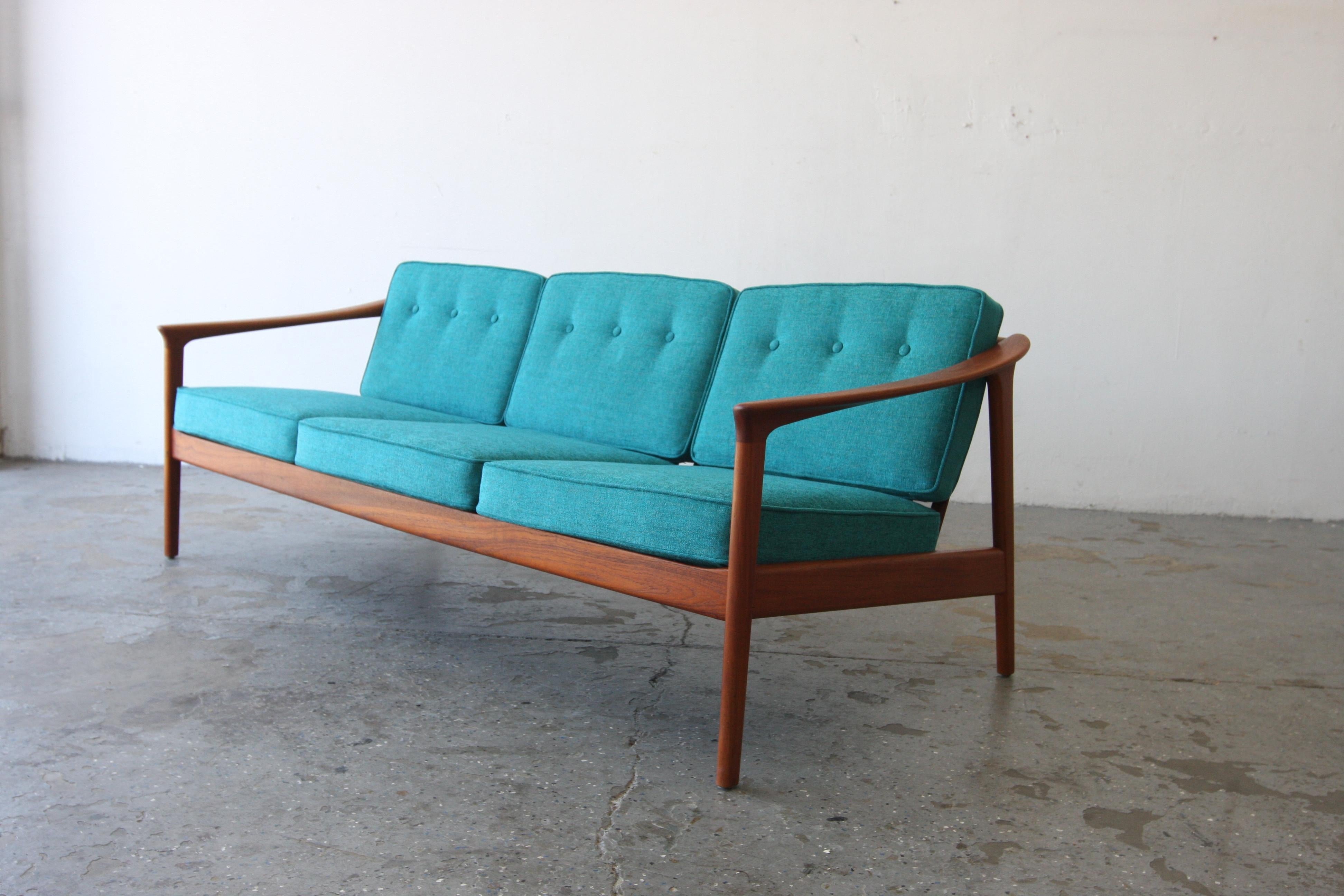 Monterey /5-161 Sofa designed by Folke Ohlsson, produced by the Swedish manufacturer Dux in the 1960’s. Sofa has profiled armrests, representing high craftsmanship, characteristic of Scandinavian design.

74 inches long 29 high 29 deep 

Seat W 