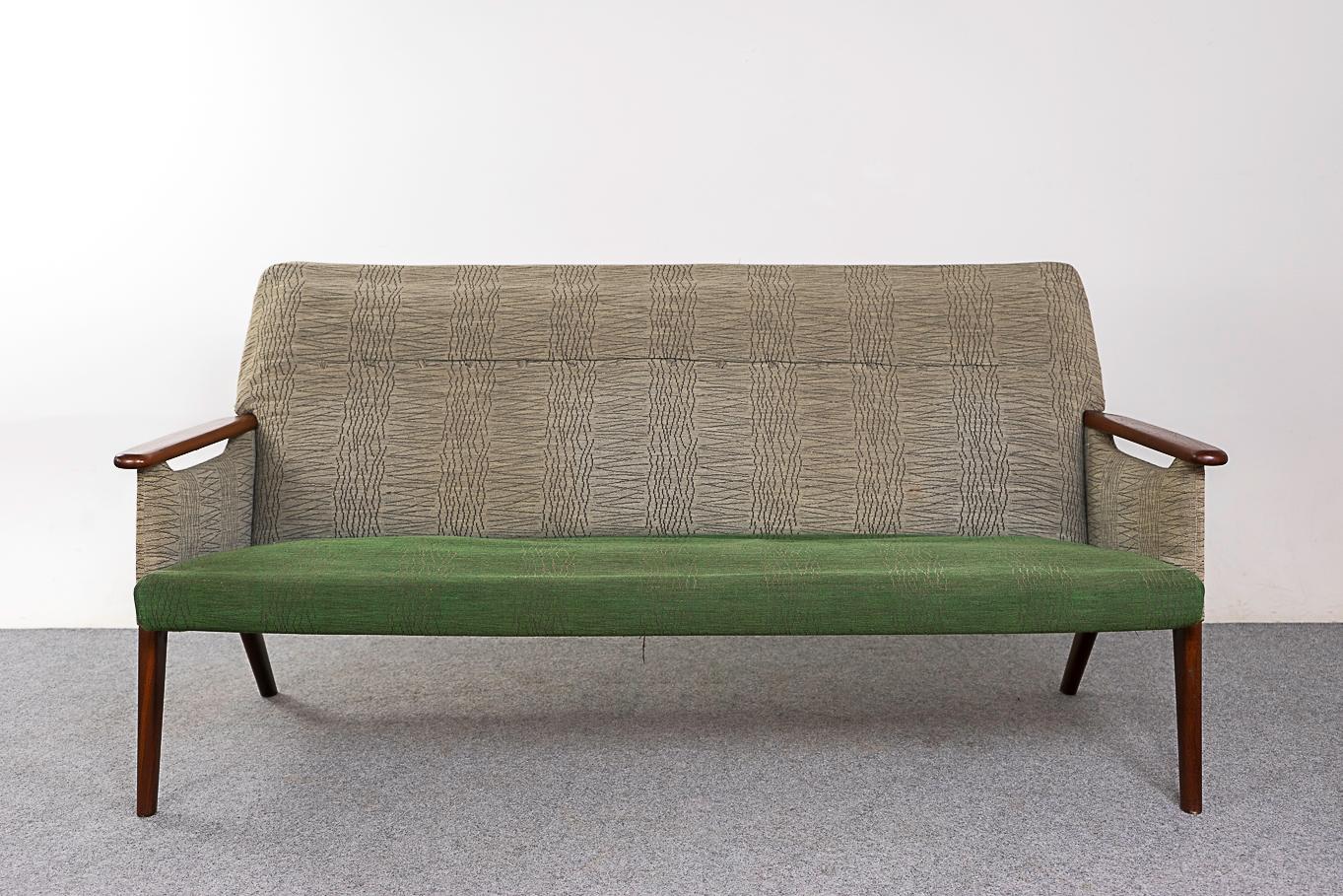 Teak Danish sofa circa 1960's. Elegant lines with floating solid wood armrests and  sleek legs. Original upholstery with significant wear, foam requires immediate replacement.

Unrestored item with option to purchase in restored condition for an