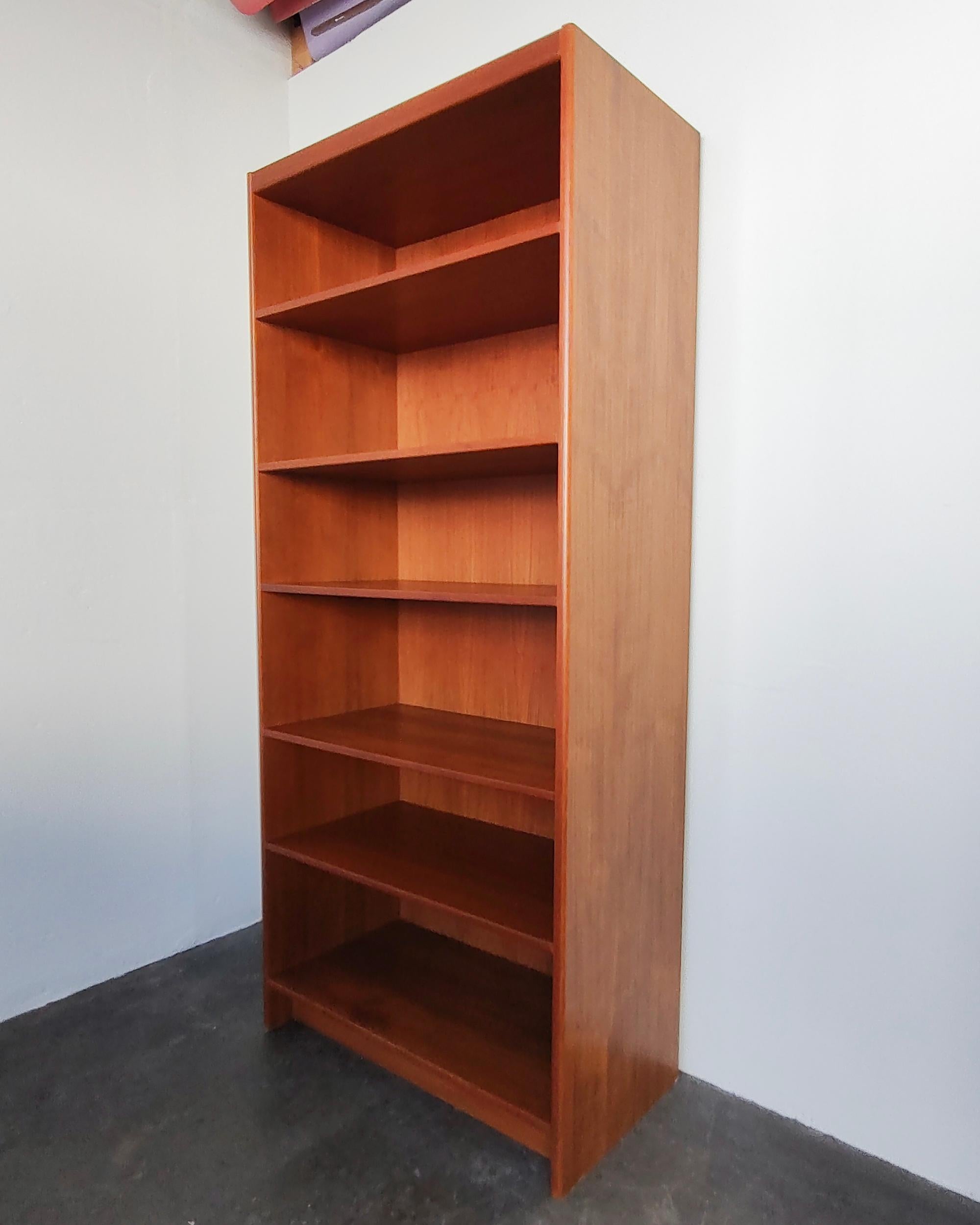 Vintage Danish modern teak wood tall shelf. Six shelves, five of which are adjustable. Overall great original condition, some light wear present consistent with vintage age. If the shelves are rearranged from the current positions there may be lines
