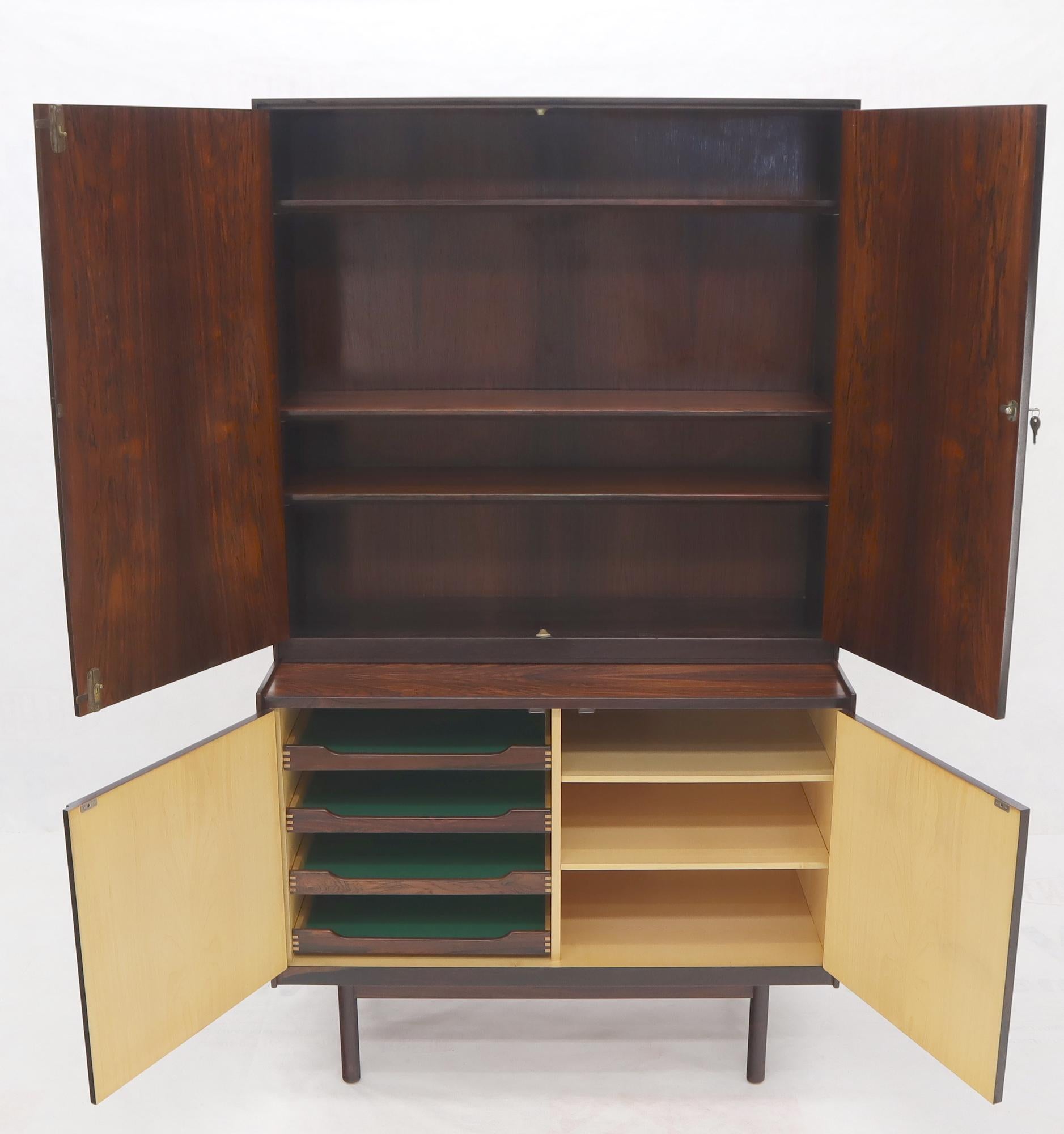 Stunning two part Danish Mid-Century Modern rosewood credenza cabinet. The base cabinet Cam be use by itself and it measures: 20 x 41 x 31