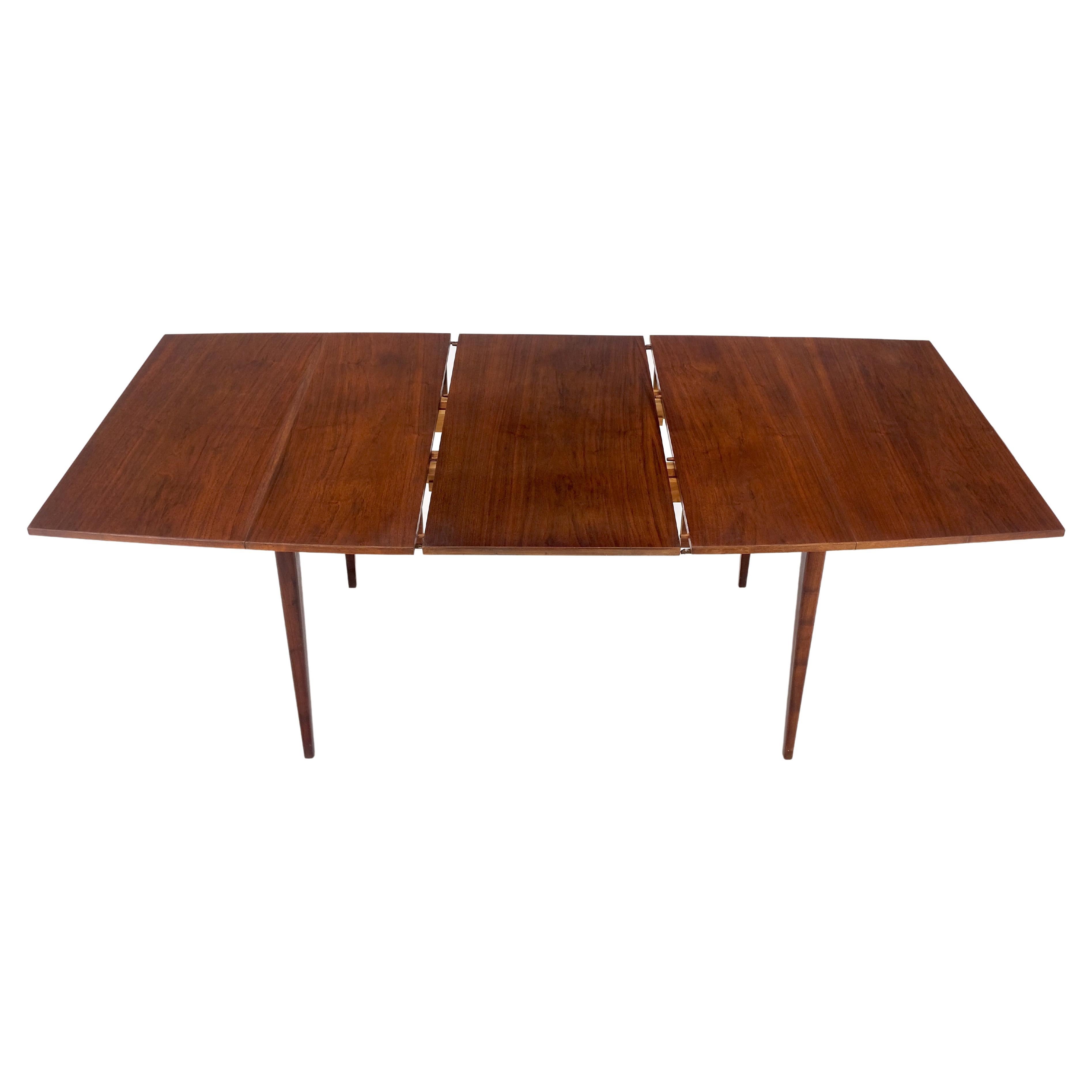 Danish Mid-Century Modern walnut drop leaf dining table w/ extension leaf mint!
Side leaves measure: 17 inches across. Center leaf measures: 20 inches across.