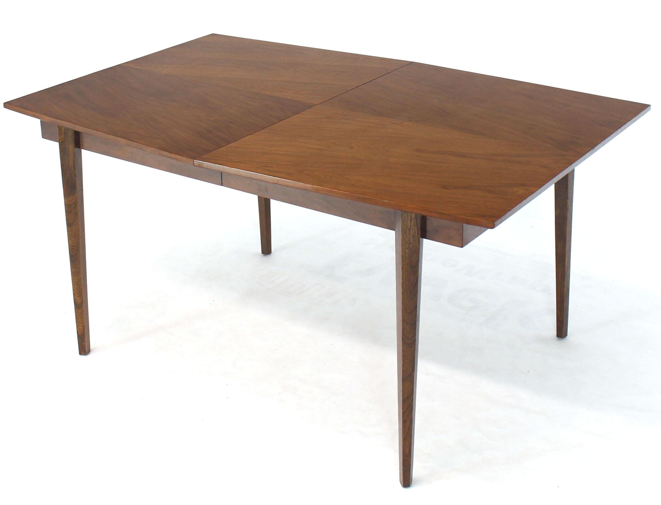 Mid-Century Modern oiled walnut finish wide angle dining table with two 18