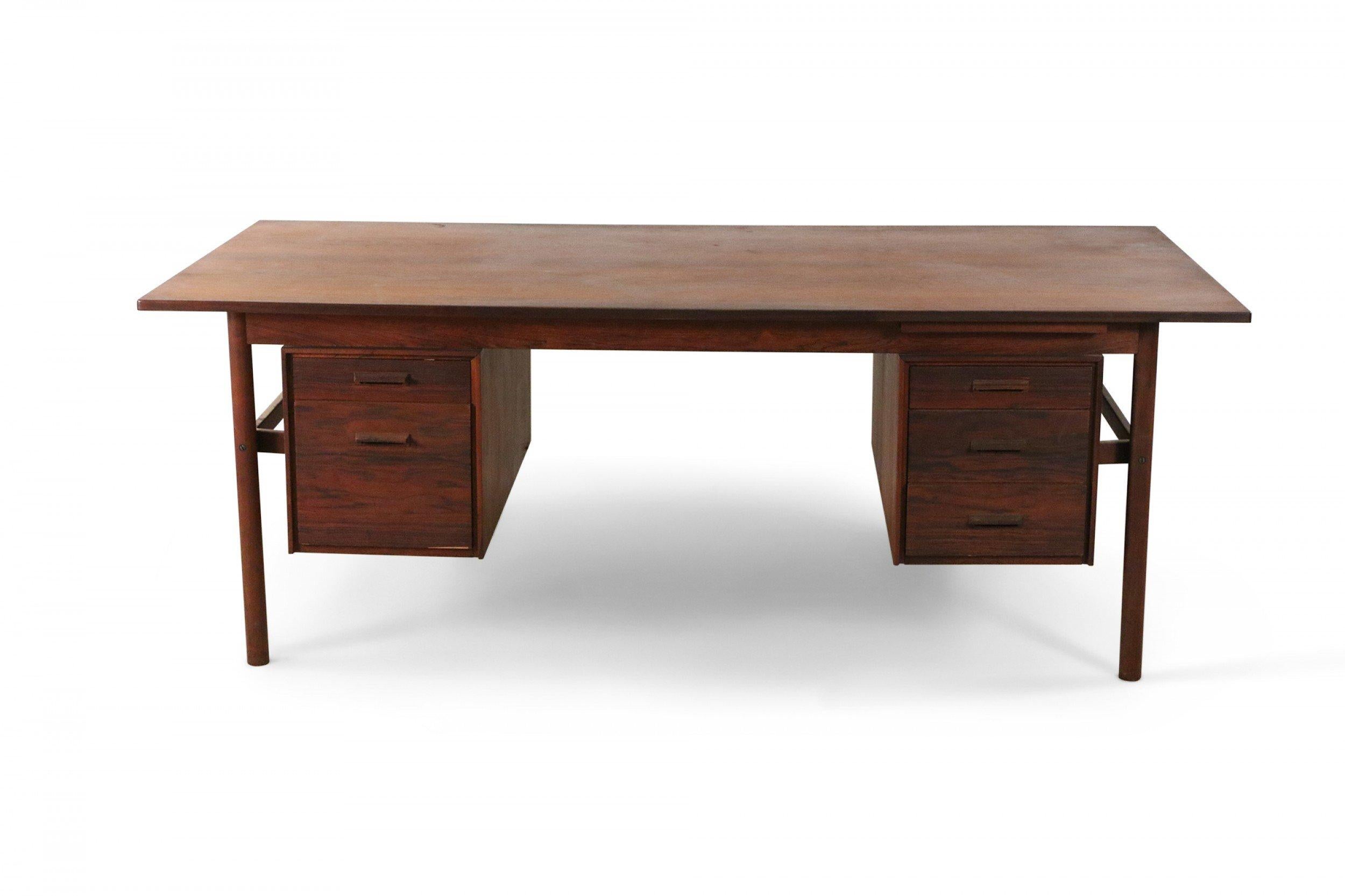 Midcentury Danish wood desk with rectangular top and two sets of drawers float-mounted under the desktop (2 drawers on left, 3 drawers on right).