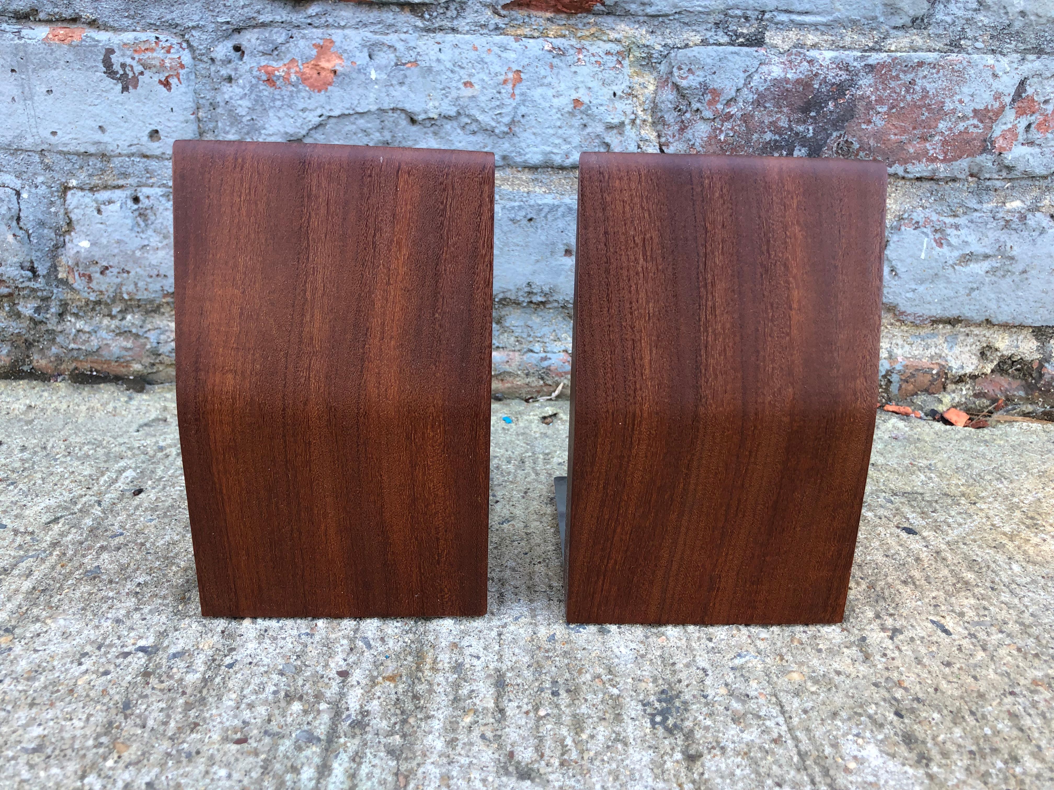 Gorgeous and elegant Danish Mid-Century Modern bookends. Sleek and minimal design with lovely warm blood tones. Lined underneath and can be used on any surface.