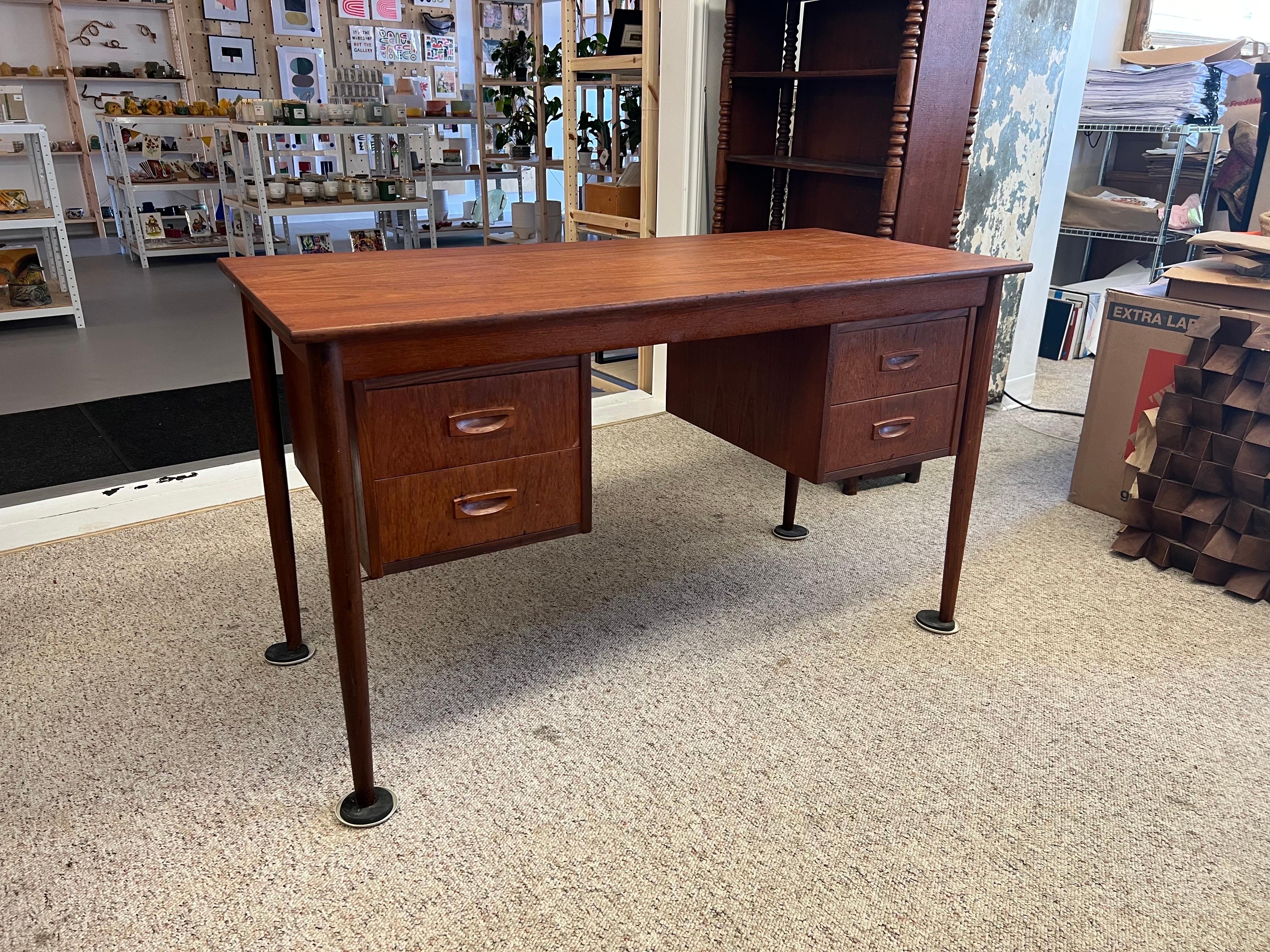 Danish Mid-Century Modern Writing Desk with Dovetail Drawers. Finished Back

Dimensions. 49 W ; 23 D ; 28 1/2 H
Knee Clearance. 17 W ; 25 1/2 H.