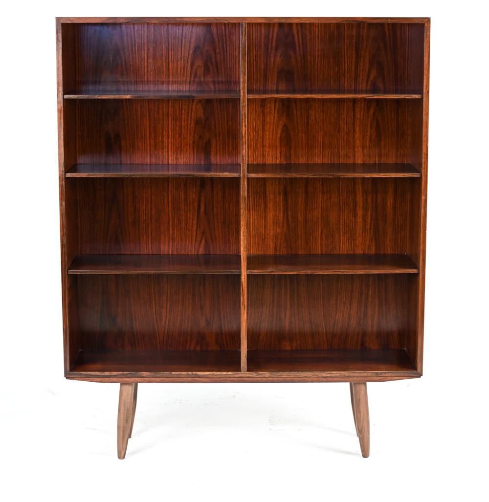 This is a handsome Danish mid-century bookcase in rosewood by Omann Jun, with original label on back: Omann Jun, Model Nr. 6.