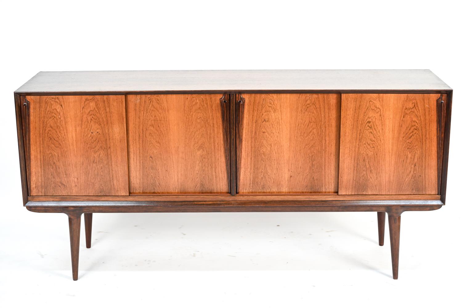 A Danish mid-century rosewood sideboard by Omann Jun, retaining remnants of label on back.