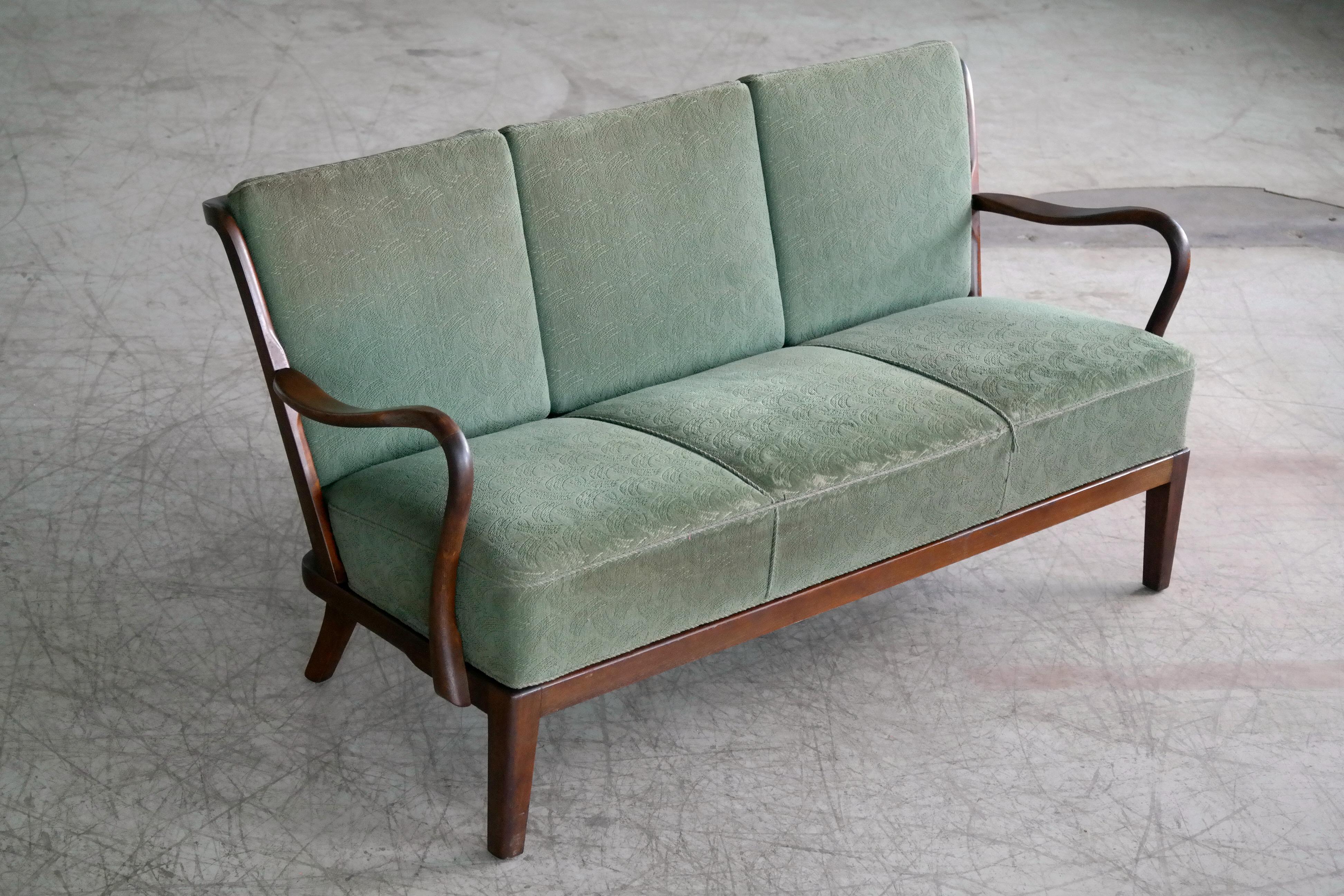 Sought after three-seat open arm sofa in beech and wool manufactured in Denmark in the 1940s by Slagelse Mobelvaerk as Model 95. The frame is in very good original condition with the stained and varnished beech wood showing some appropriate wear and