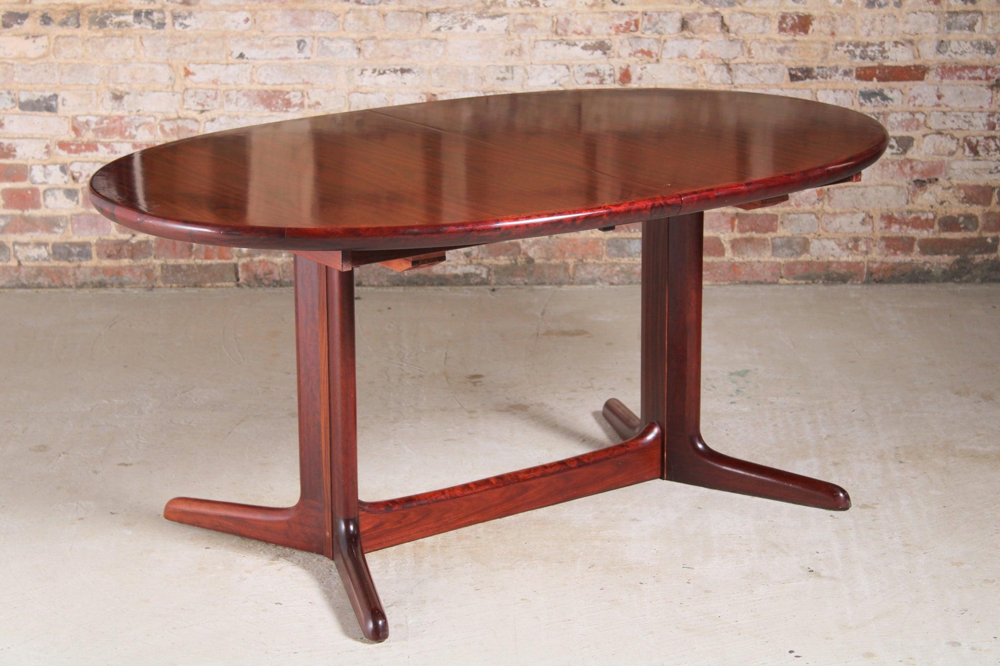 Danish mid century oval rosewood dining table, circa 1970s. 2 Extension leaves stored underneath, seats up to 12 people. 

Dimension: W 164cm/214cm/264cm x D 103cm x H 74cm.