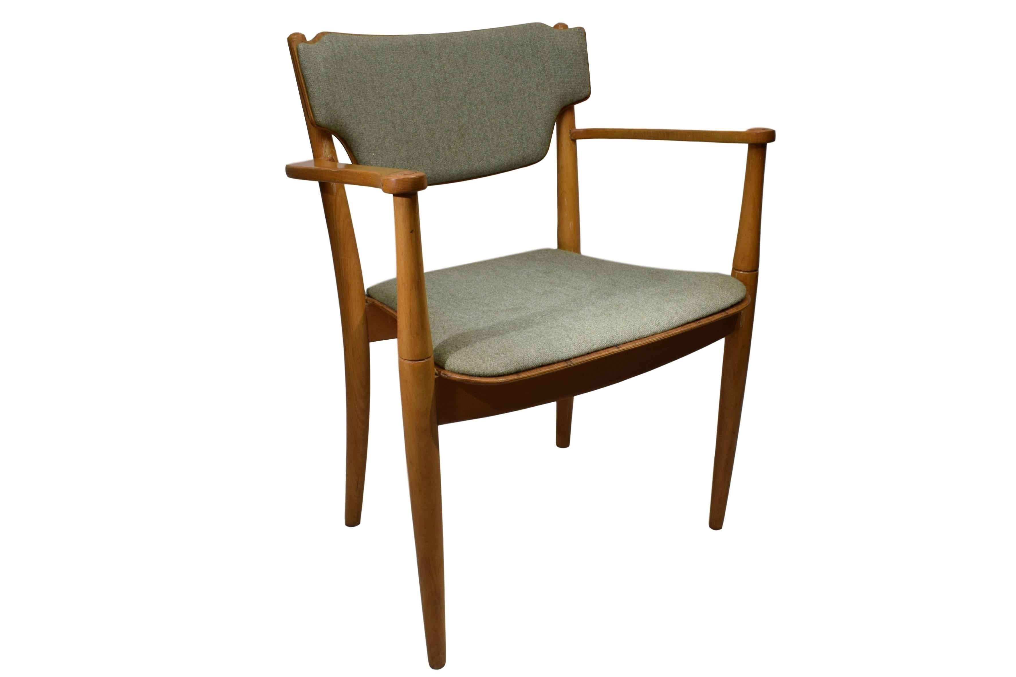 A Danish midcentury Portex armchair by Peter Hvidt (1916 - 1986) & Orla Mølgaard (1907-1993). Design from 1945. Produced by Fritz Hansen. The frame is made from beech and has a light-greenish woollen fabric upholstery. The rear legs are steam-bent.