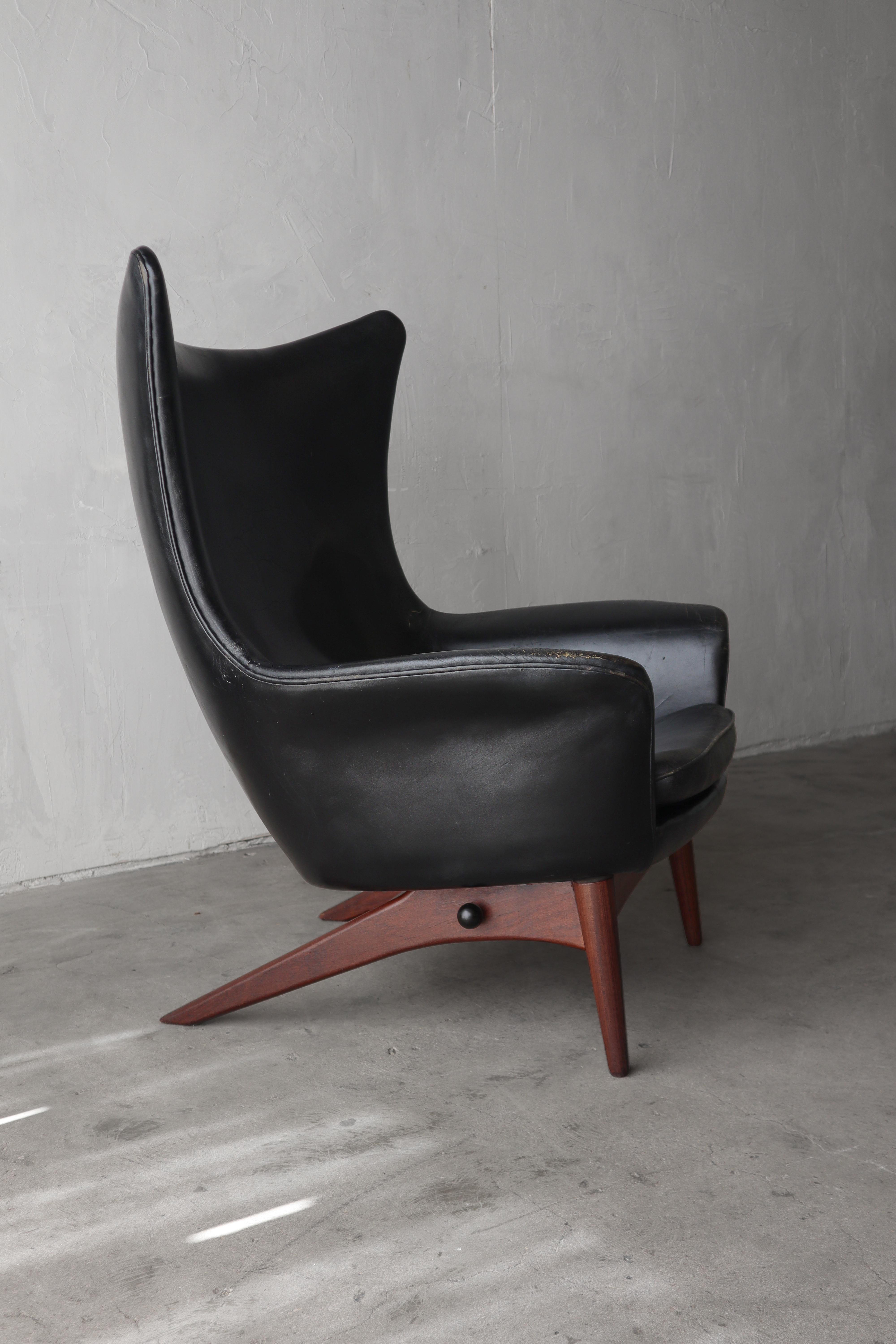 This sculptural reclining lounge chair by Henry Walter Klein is the epitome of Danish design.   

The chair features a beautiful wingback design and multi-position, locking recliner feature for maximum comfort.  The trailing walnut legs add to the