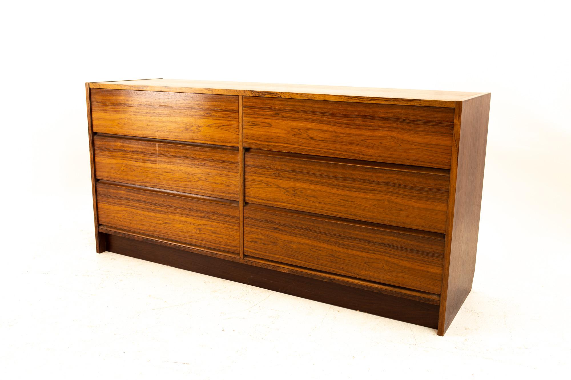 Danish Mid Century rosewood 6 drawer lowboy dresser
Dresser measures: 59.75 wide x 18.25 deep x 29.25 high

All pieces of furniture can be had in what we call restored vintage condition. That means the piece is restored upon purchase so it’s free