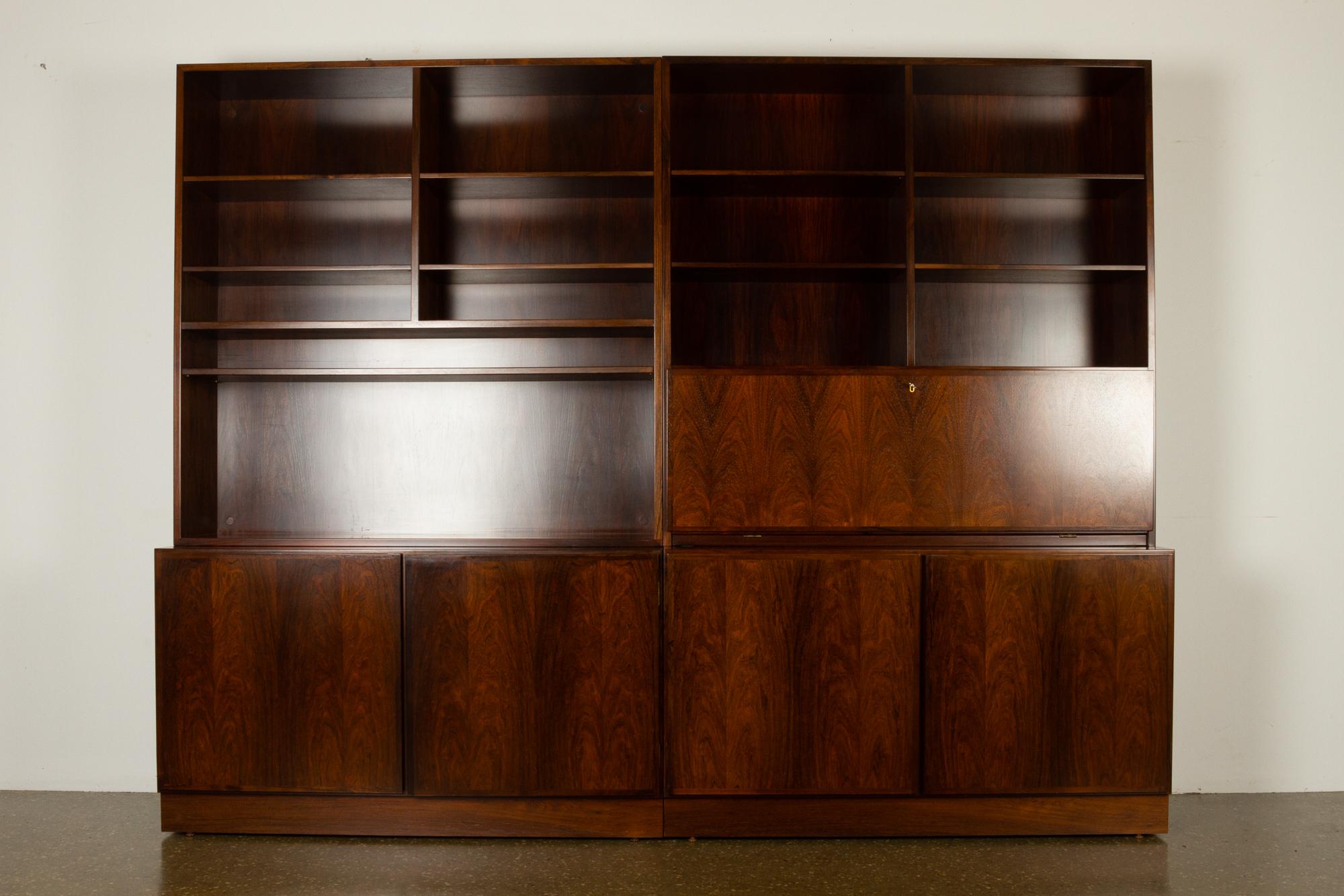 Danish midcentury rosewood book case by Omann Jun, 1960s
Large set of bookcases and cabinets in rosewood in four units. Designed and manufactured by Danish company Omann Jun A/S.
This wall unit consists of two bookcases, model no 5 and 9, sitting