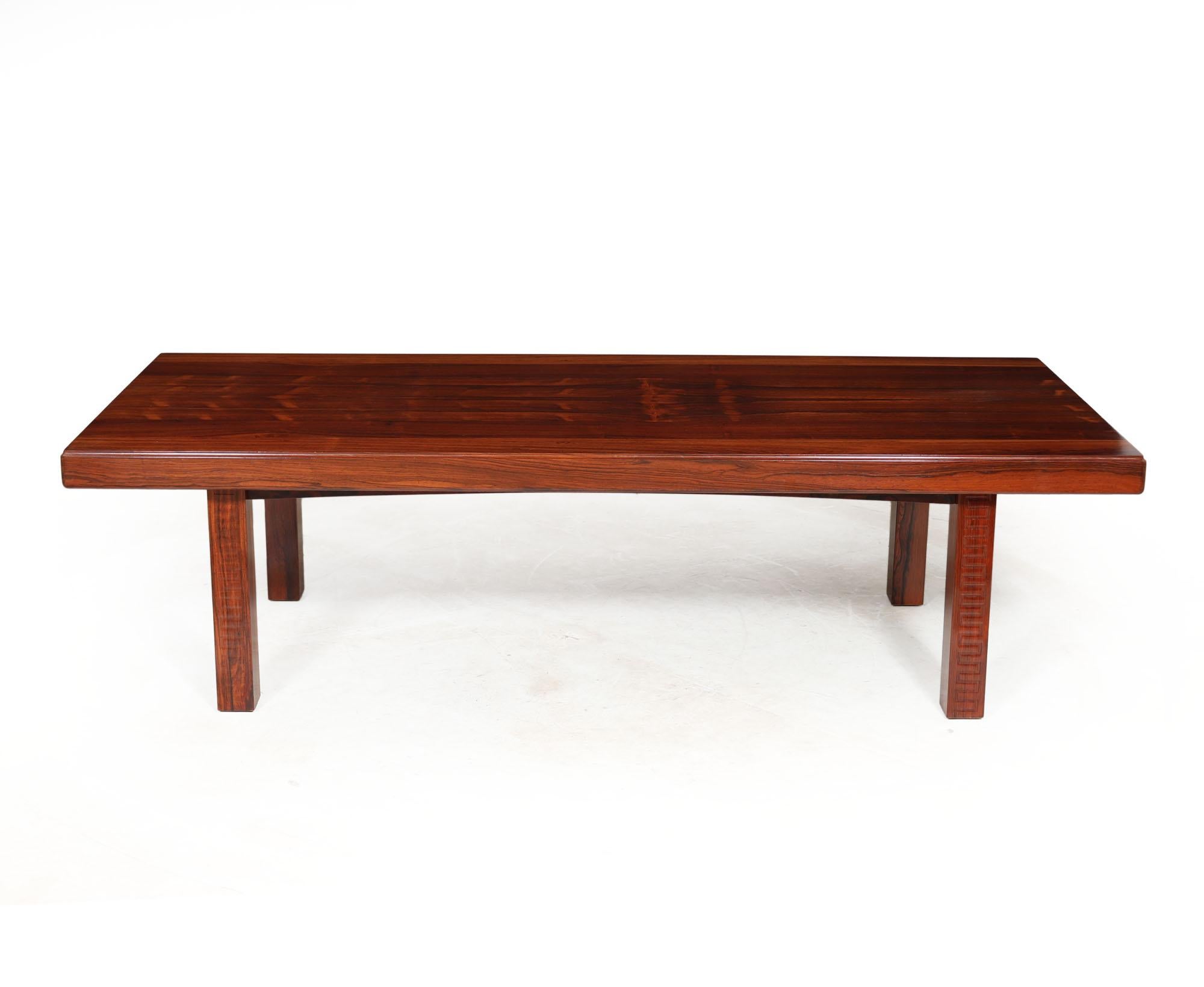 DANISH MID CENTURY COFFEE TABLE
This mid-century rosewood coffee table showcases a classic Danish design that transcends trends, making it a timeless addition to any living room decor. Its sleek lines and warm rosewood finish exude elegance and