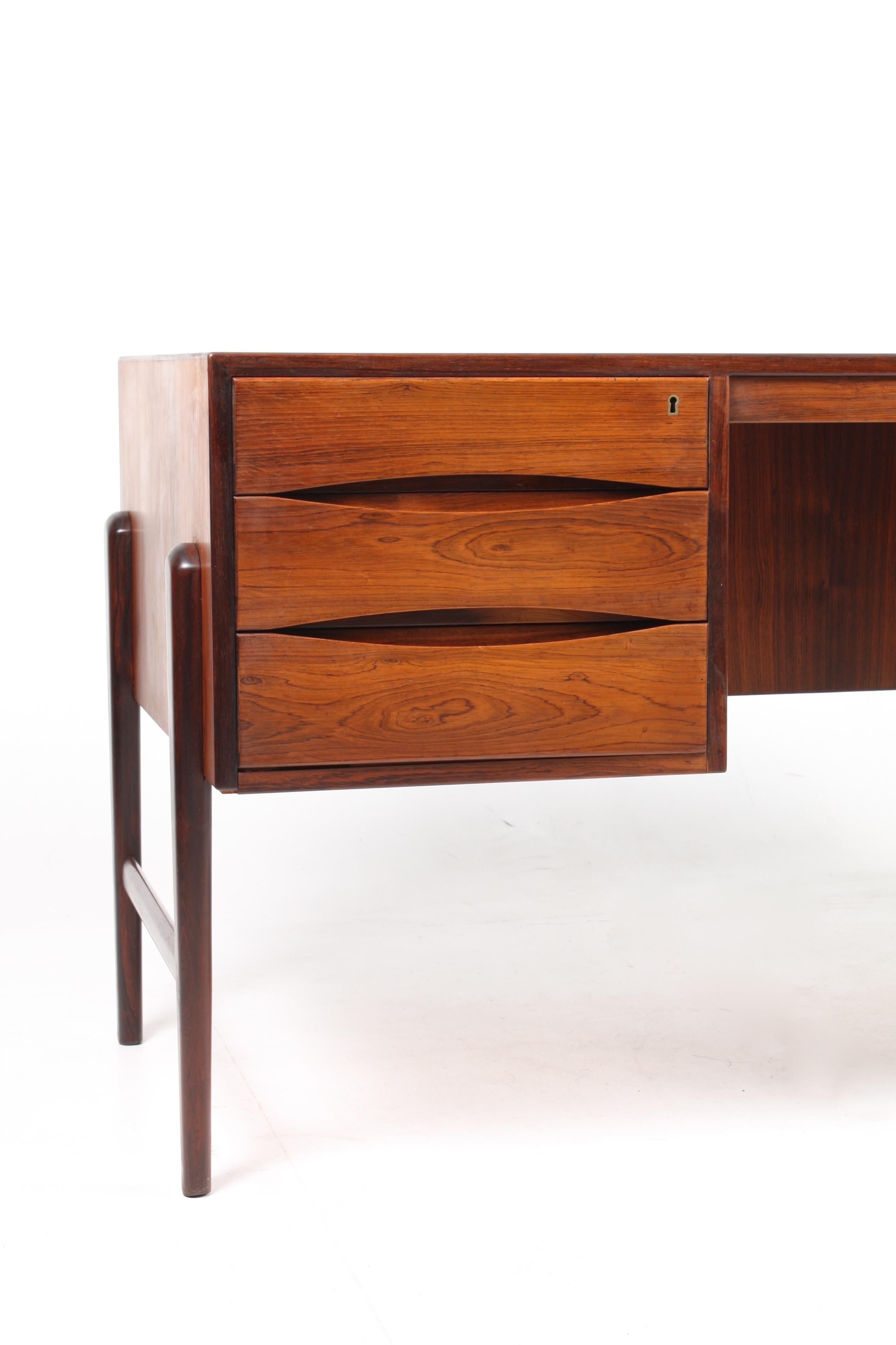 Freestanding desk in rosewood designed and made in Denmark in the 1960s. Great condition.