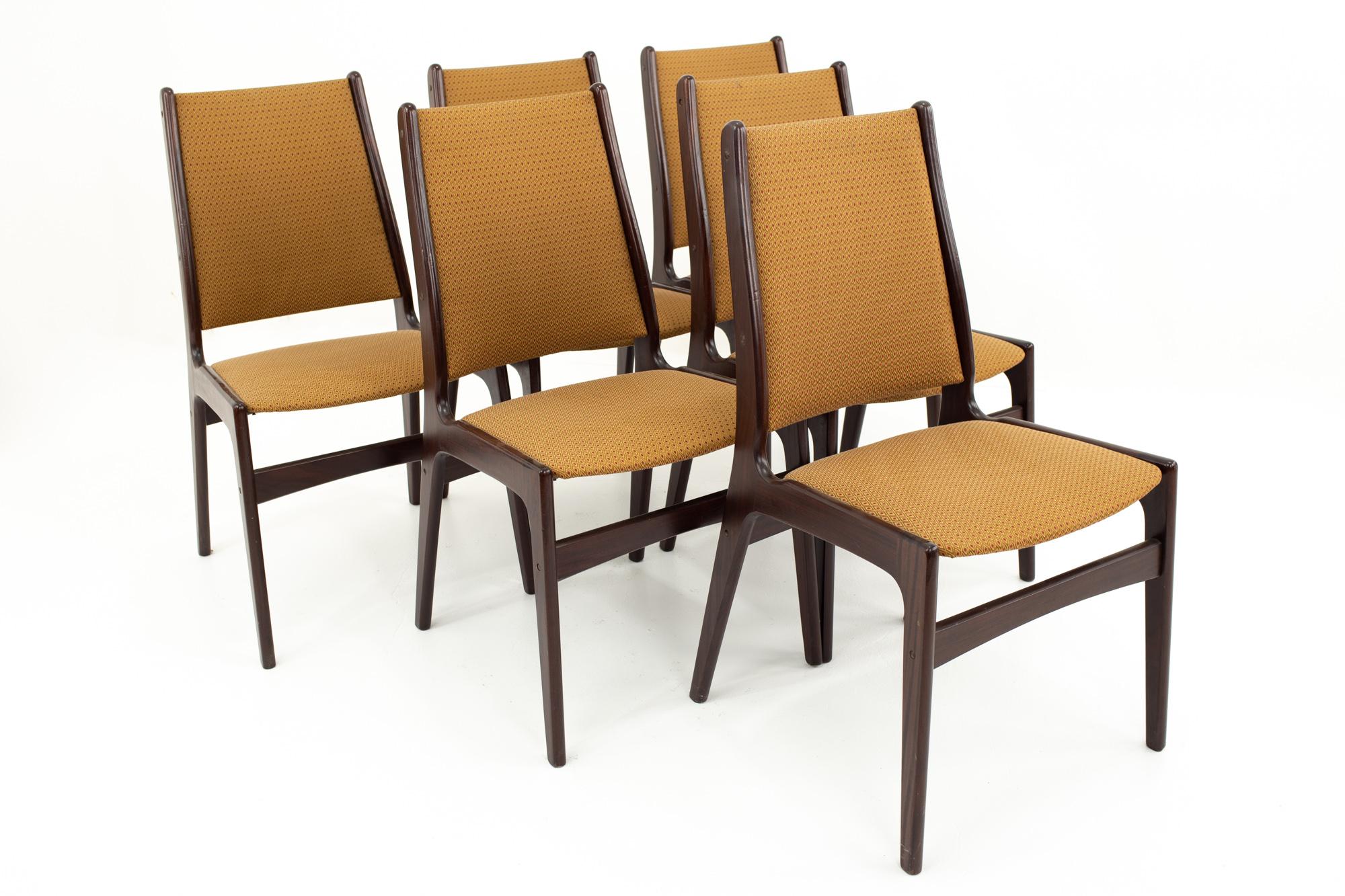 Danish midcentury rosewood dining chairs - Set of 6

Each chair measures: 19 wide x 17 deep x 36 high with a seat height of 18.5 inches

This set is available in what we call Restored Vintage Condition. Upon purchase it is thoroughly cleaned and