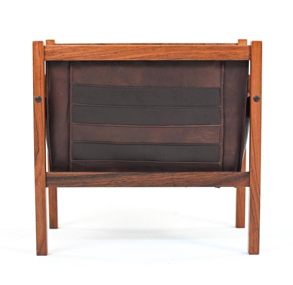 A handsome Scandinavian mid-century magazine holder in rosewood and horizontally quilted brown supple leather with suede interior. With a rosewood removable insert for support and keeping shape. A stylish modern accent for any room! No apparent