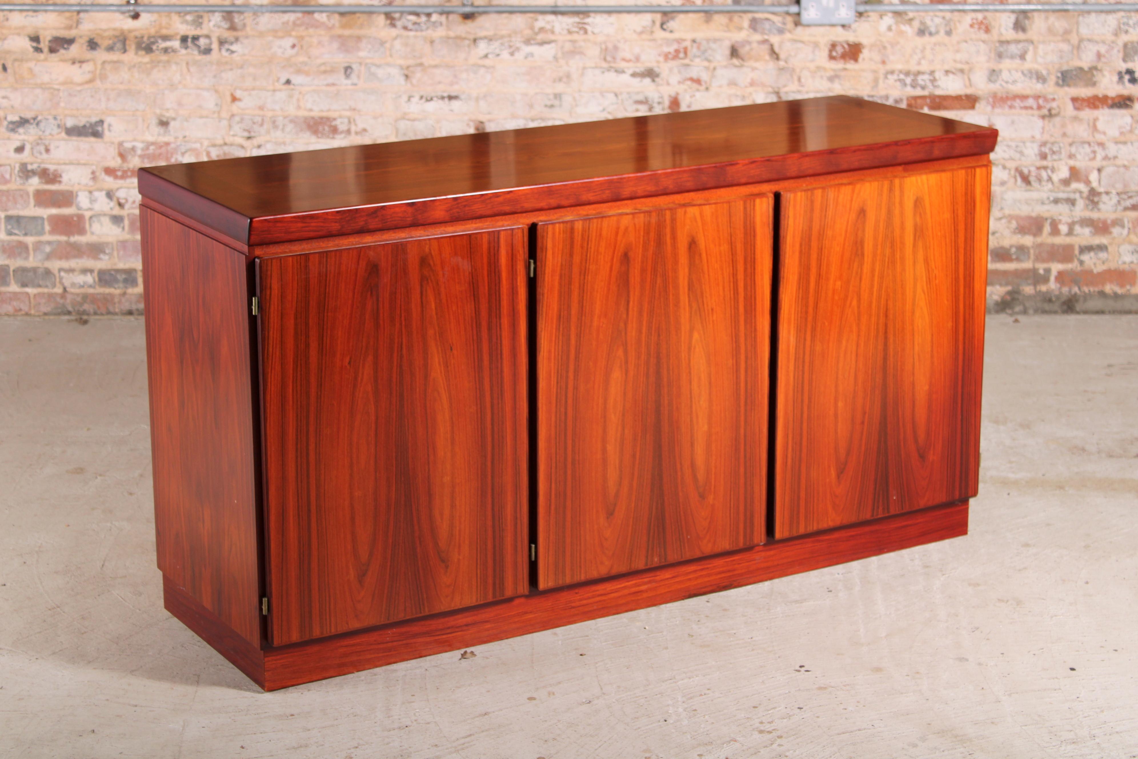 Danish mid century rosewood sideboard by Skovby, circa 1970s. Double cupboard with shelves and single cupboard with 5 felt lined drawers. Very good original condition. £750 Dealer #10

Measures: W 154cm
D 48cm
H 83cm.