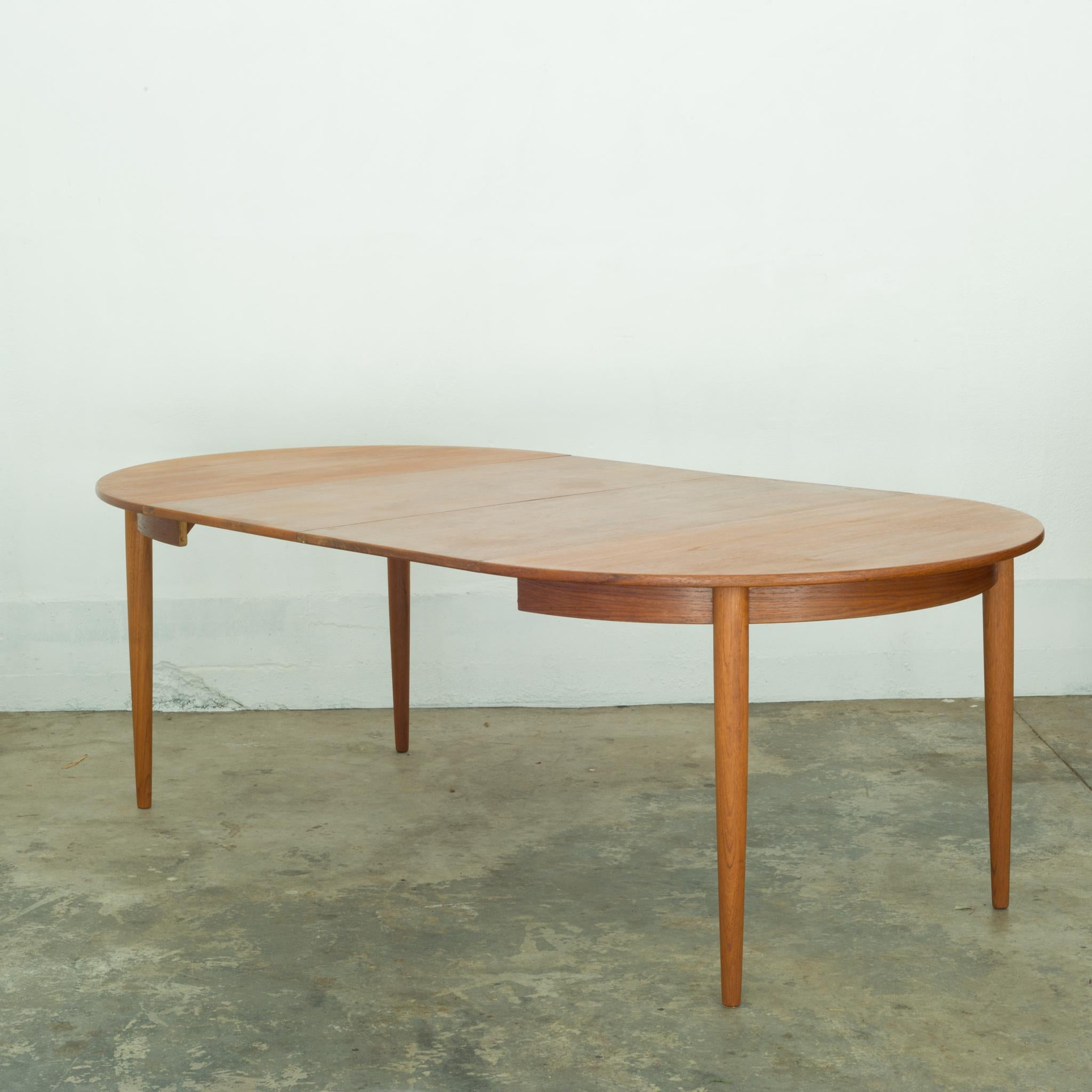 About

This is an original round to oval extension Teak dining table with two leaves that drop into place. The leaves are minus the trim of the table which creates a striking silhouette unique from the round table.

Creator Gudma Mobelfabrik,