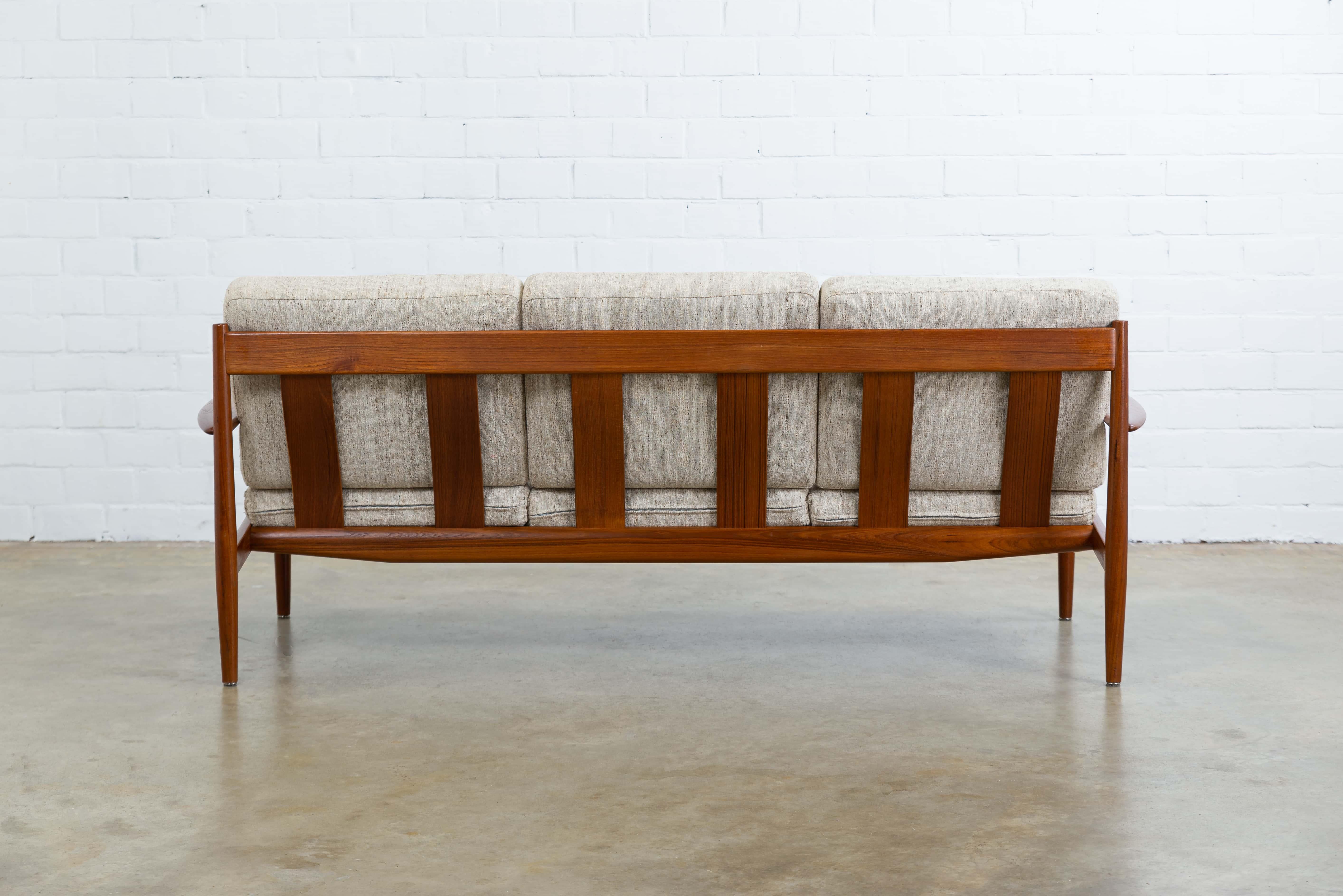 Beautiful sofa in teak with the original beige wool upholstery.
Designed by Grete Jalk for France & Daverkosen in 1962.
The sofa is in good vintage condition and marked.
The two accompanying armchairs are also available, more info on request.