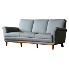 Danish Mid-Century Sofa in Grey Wool and Decorative Teak Base. 1950
s Danish Mid-Century Sofa in Grey Wool and Decorative Teak Base. 1950
s