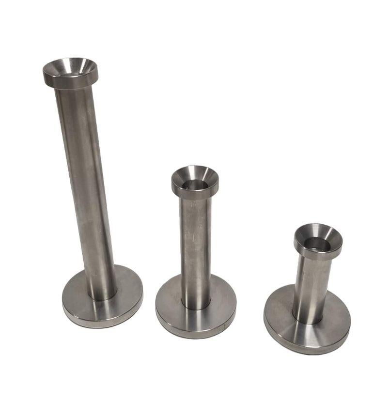 Introduce a touch of mid-century modern charm to your decor with this set of three Mid-Century Stainless Steal Candlesticks, each standing at an elegant 9.5 inches and crafted in varying sizes. The sleek aluminum design captures the essence of