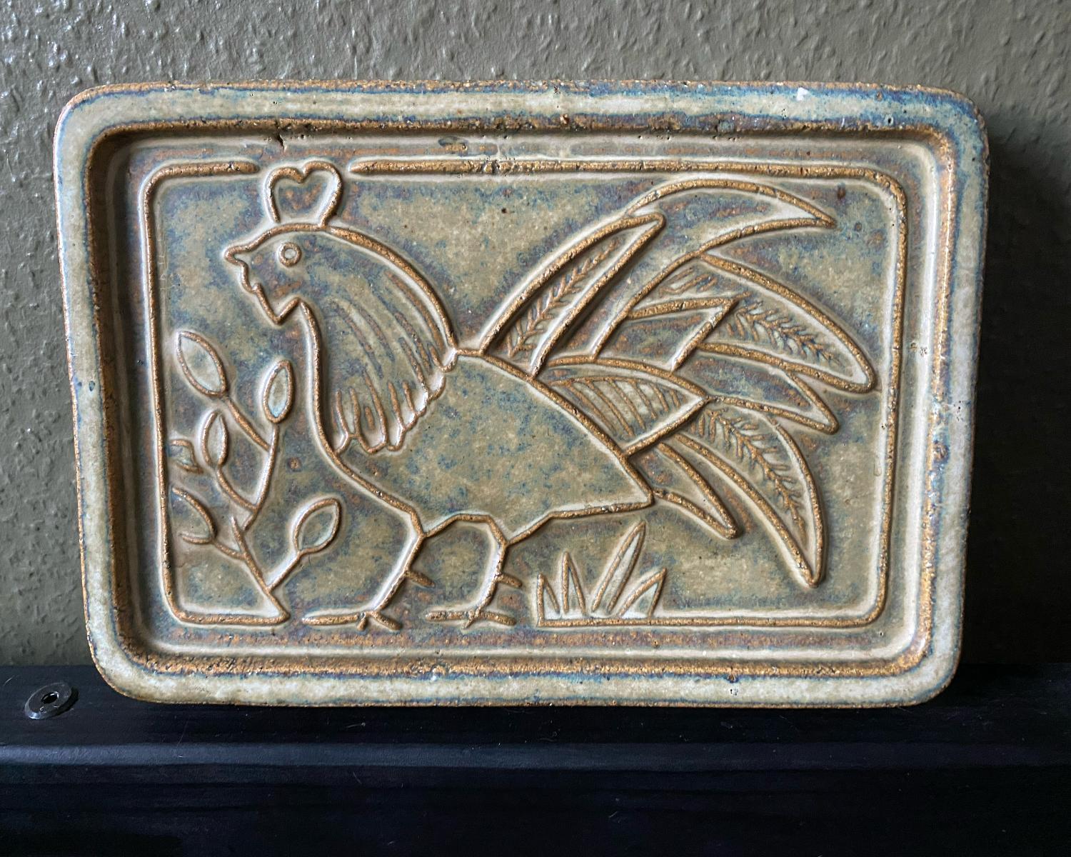 Nice stoneware wall plaque relief of a rooster in soft colors by Soholm Pottery Denmark. Markers mark and model number stamped at the back.