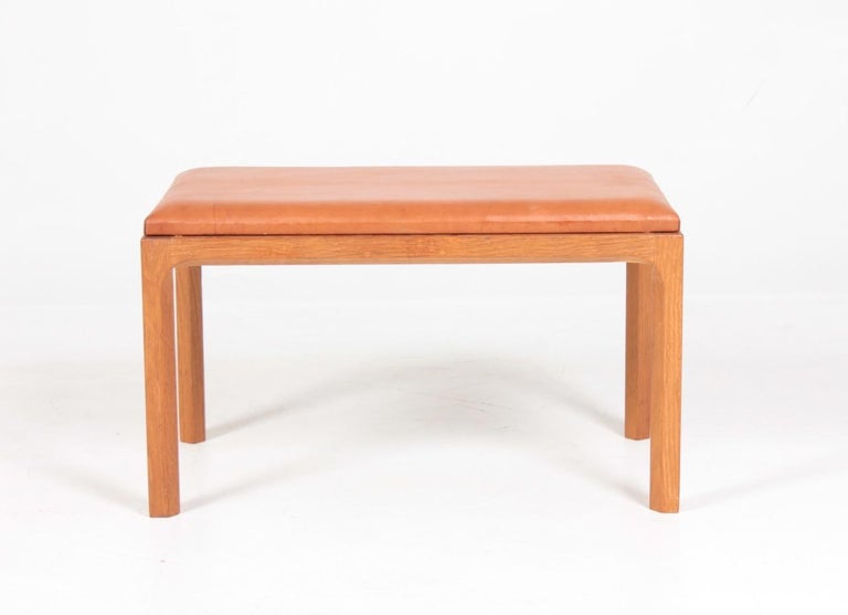 Scandinavian Modern Danish Midcentury Stool in Patinated Leather and Oak by Kai Kristiansen For Sale