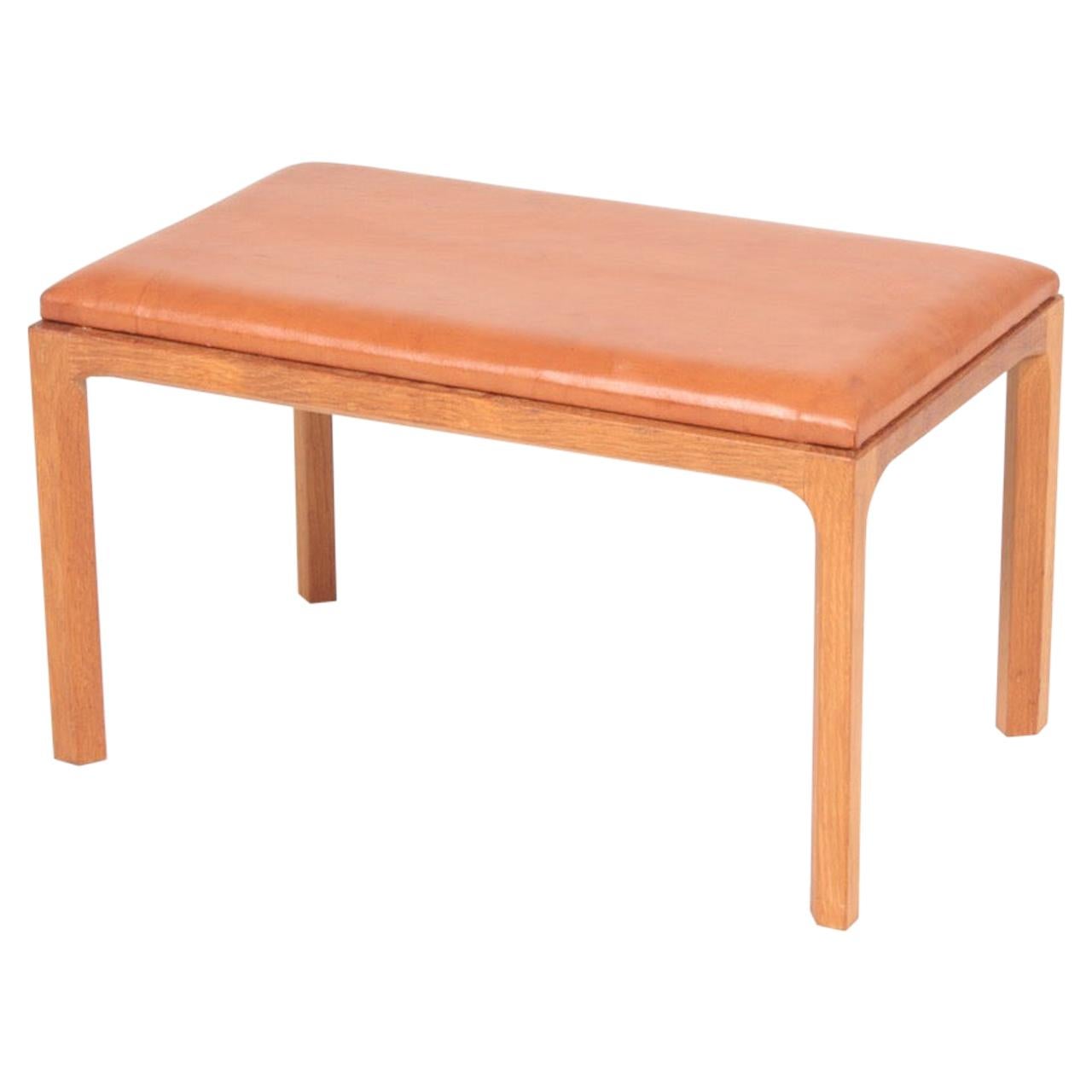 Danish Midcentury Stool in Patinated Leather and Oak by Kai Kristiansen