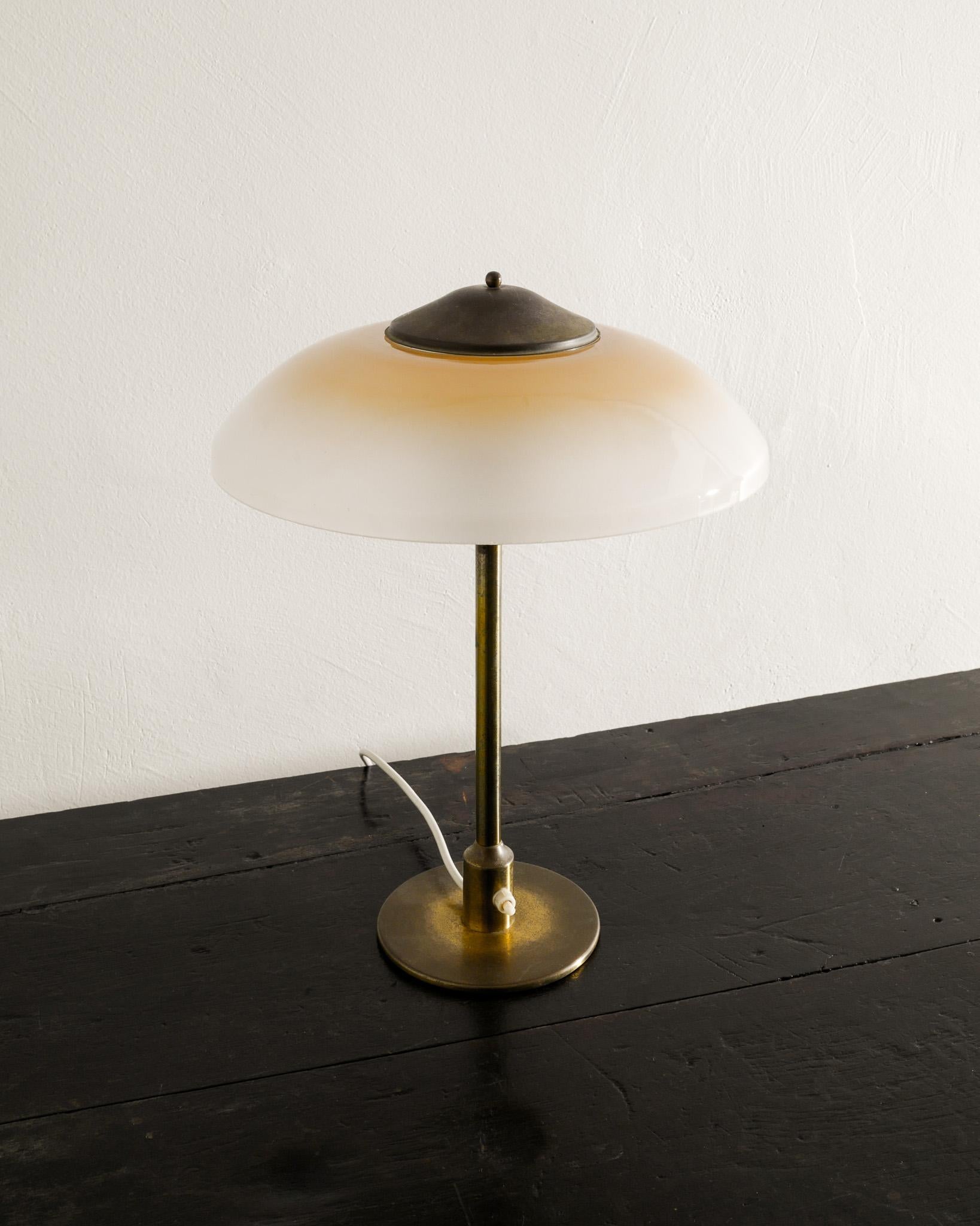Rare Danish mid century desk / table lamp in patinated brass and frosted opaline glass shade produced by Fog & Mørup Denmark 1950s. In good working and original condition. 

Dimensions: H: 40 cm / 15.75