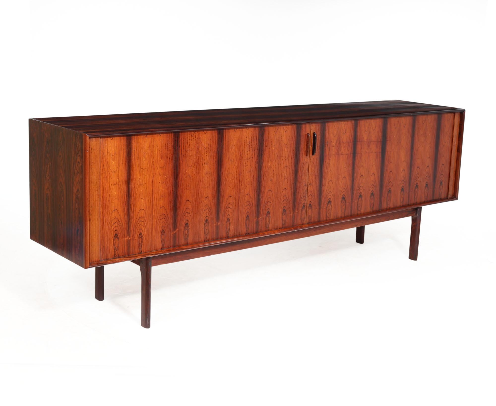 MID CENTURY TAMBOUR DOOR SIDEBOARD 
A lovely mid century danish sideboard with tambour doors designed and produced by Bernhard Pedersen in the 1960’s, the tambour doors slide smoothly and slide as if to disappear inside the cabinet, freestanding so