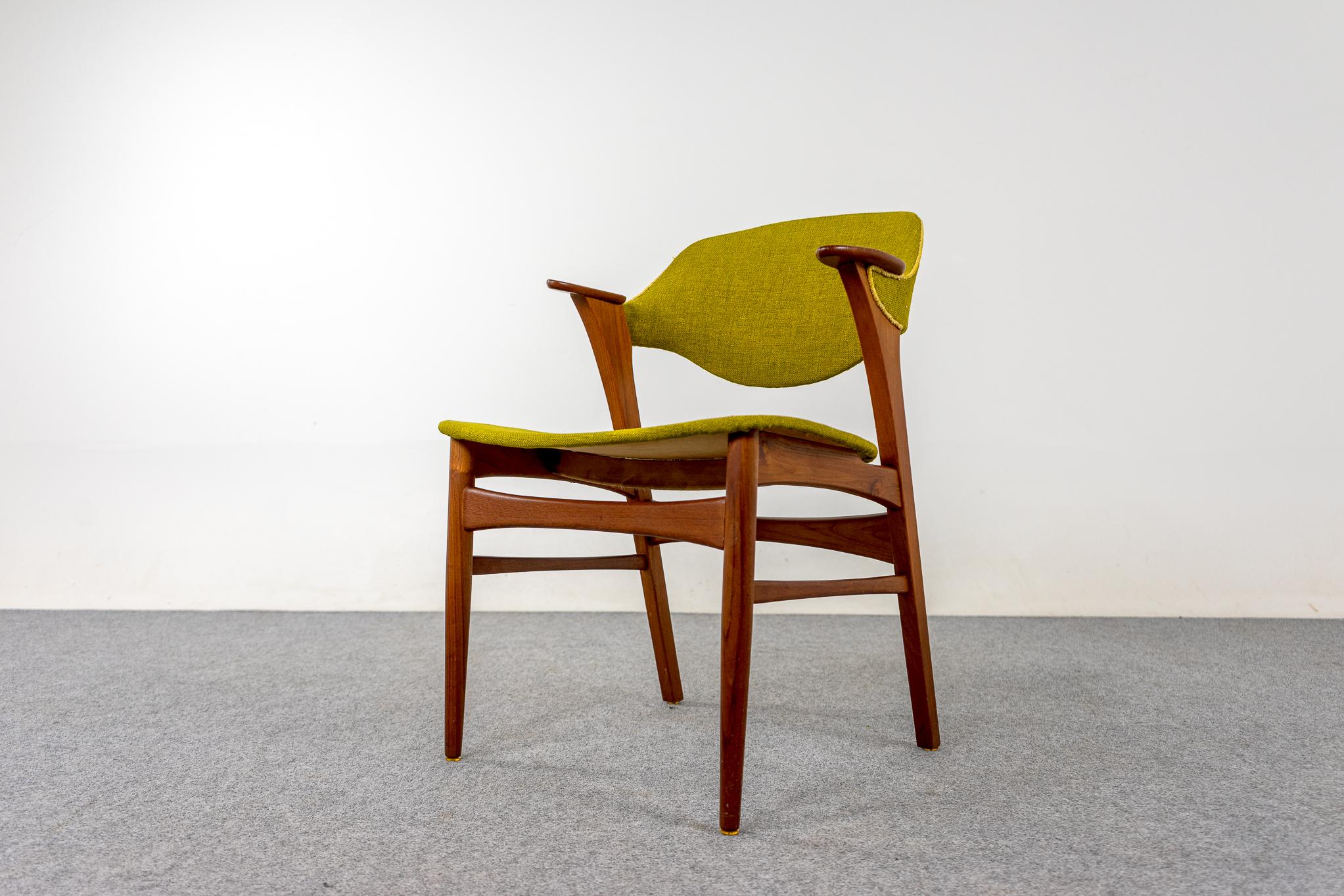 Teak Danish armchair, circa 1960's. Elegant frame with swooping arms, perfectly scaled for a desk, or side chair. Beautifully sculpted frame offers comfort without an imposing footprint. Original upholstery is very vibrant, great color. Brighten up