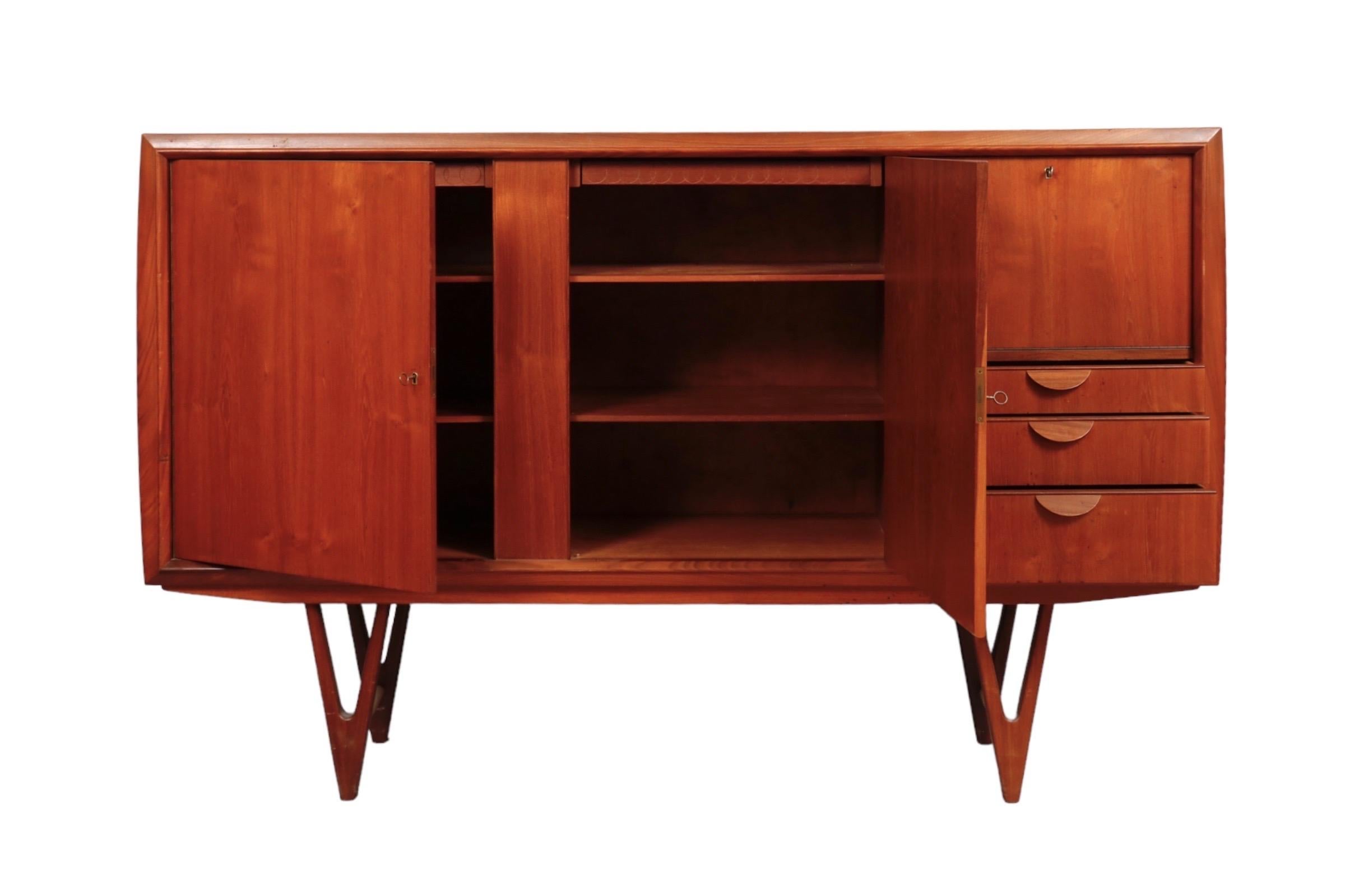 Mid-century teak Credenza bar with drawers and bar area with a mirror in the back. 

Dimensions: 
W 71” x D 18” x H 47” inches.