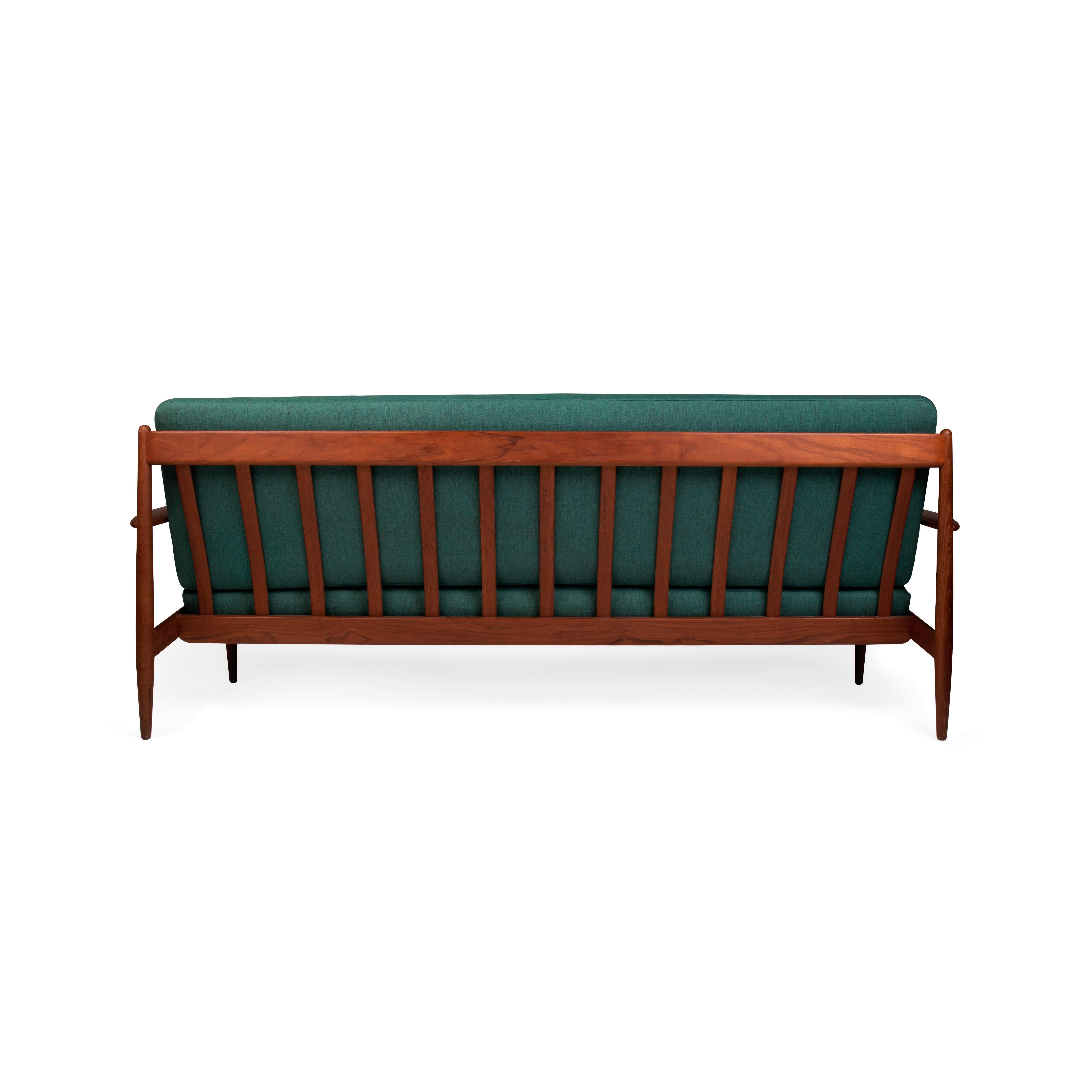 Danish mid-century teak framed sofa with original spring coil cushions For Sale 2