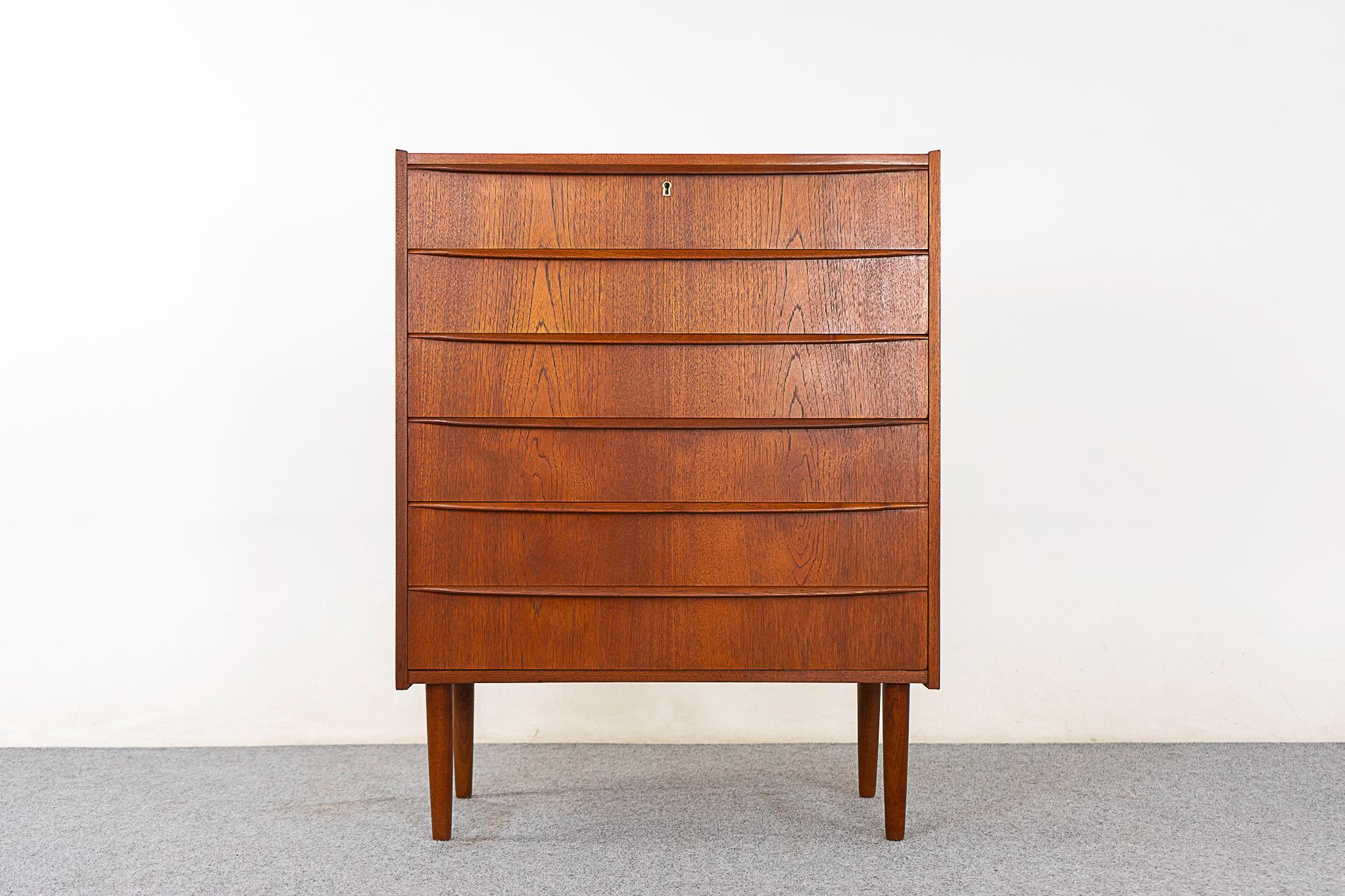 Teak Danish dresser, circa 1960's. Lovely book-matched veneer on all drawer faces and solid wood edging and legs. Dovetail constructed drawers with integrated, horizontal drawer pulls. Simple, elegant!