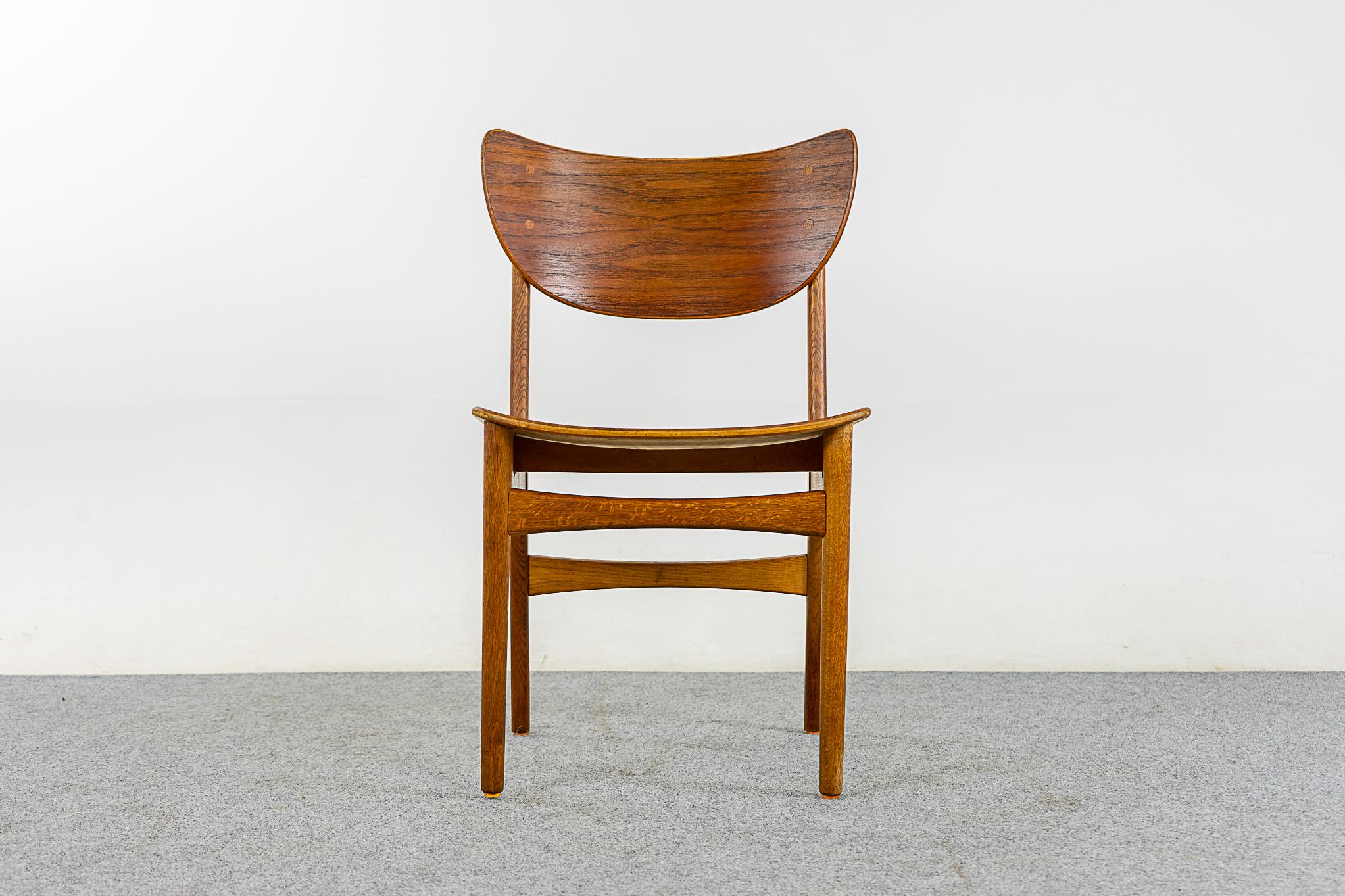 Teak & oak Danish chair, circa 1960's. Beautifully curved teak backrests and generous seat provides support and comfort. Solid oak legs with cross braces, for added stability!