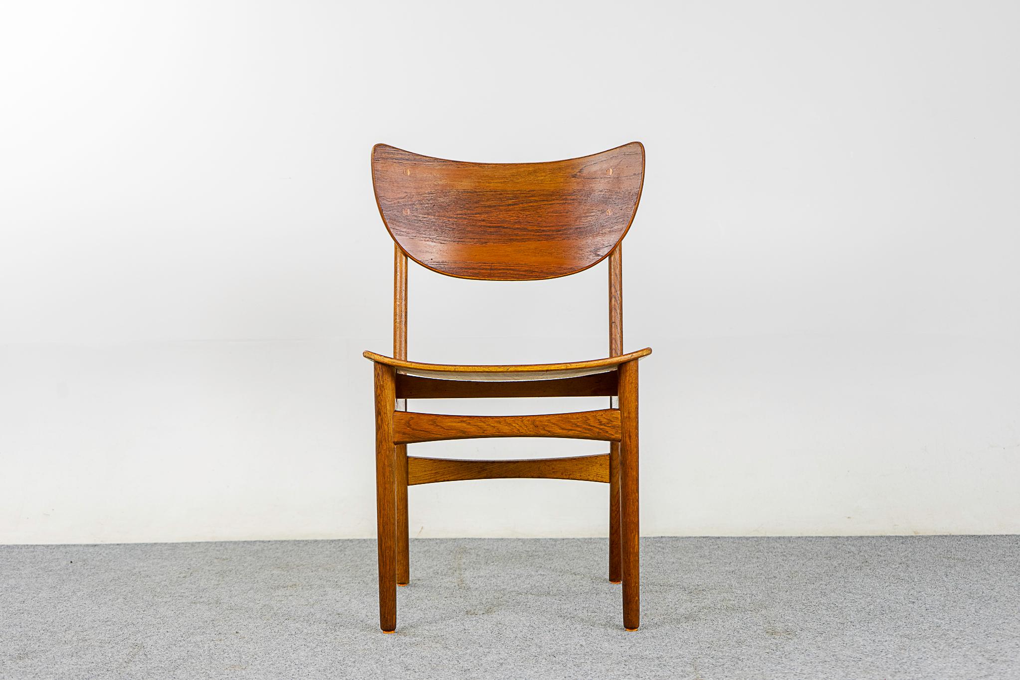 Teak & oak Danish chair, circa 1960's. Beautifully curved teak backrests and generous seat provides support and comfort. Solid oak legs with cross braces, for added stability!

Please inquire for remote and international shipping rates.