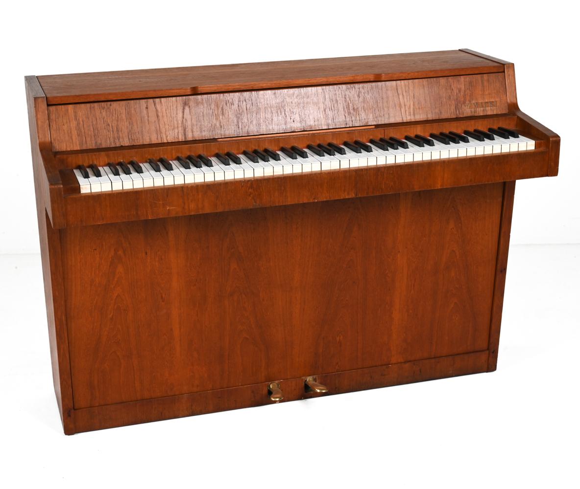 Serial No. 11494. 82 Keys. 

Step back in time with this masterfully crafted Danish Mid-Century Teak Pianette by the renowned Louis Zwicki. From the heart of the 1960's, a period when design and craftsmanship merged in perfect harmony, this pianette