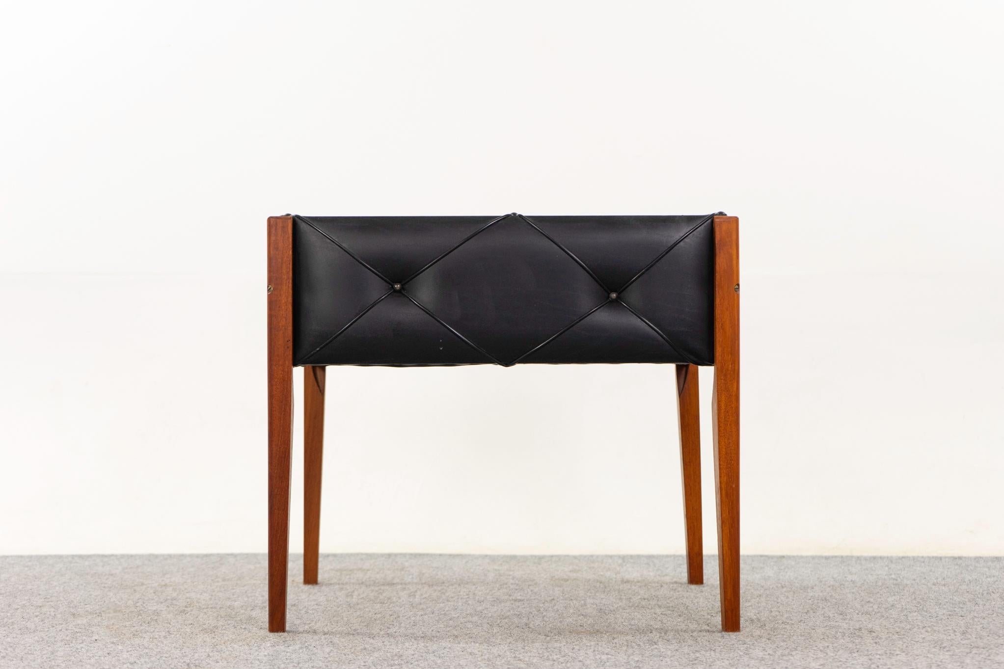 Danish mid-century teak & vinyl planter,  circa 1960's. Bring the outdoors in with this unique planter. Black vinyl case with removable tapering teak legs and original styrofoam liner. 