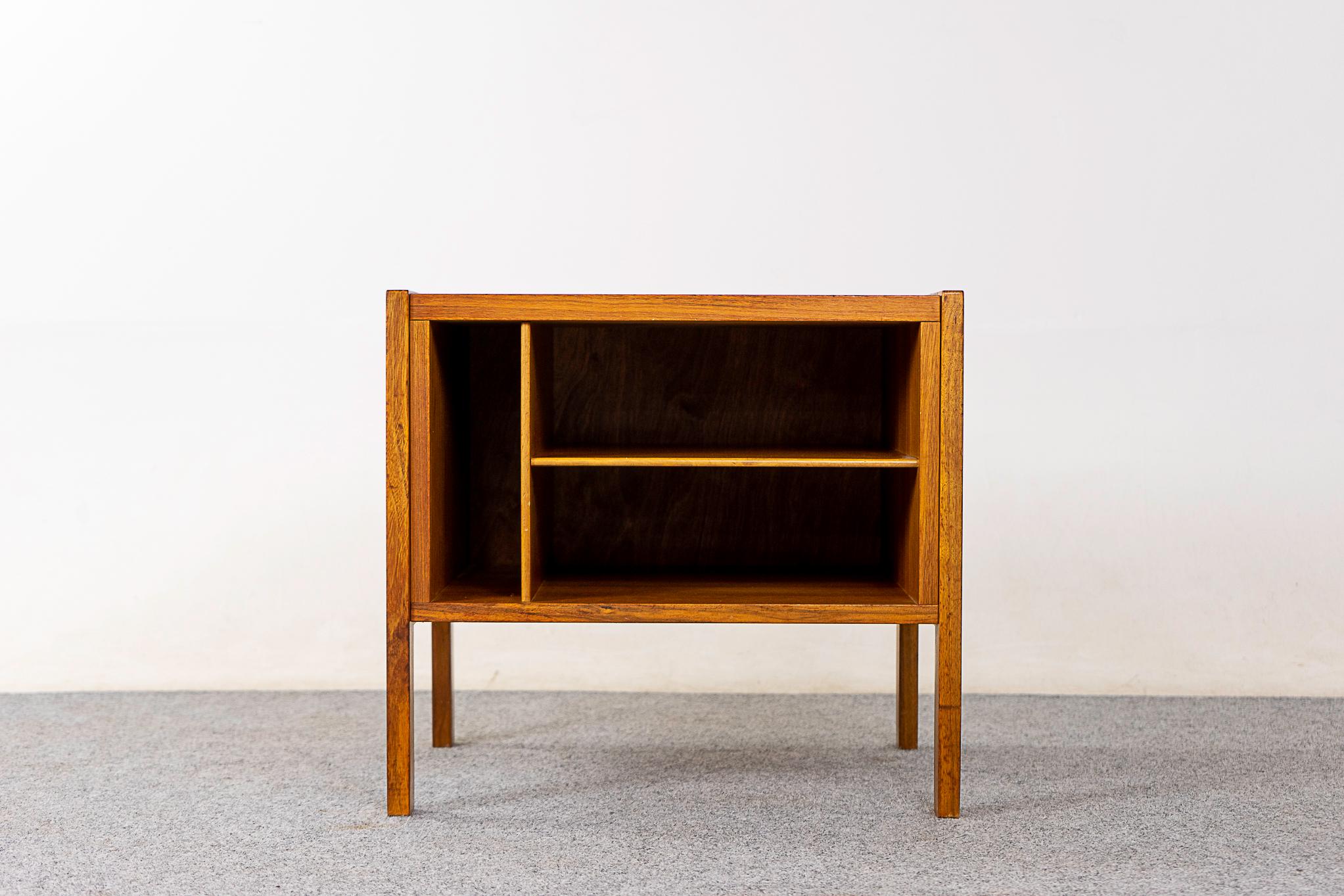 Walnut Danish bedside, circa 1960's. Veneered case with solid robust legs. Divided open cubby, get organized! 

Please inquire for remote and international shipping rates.