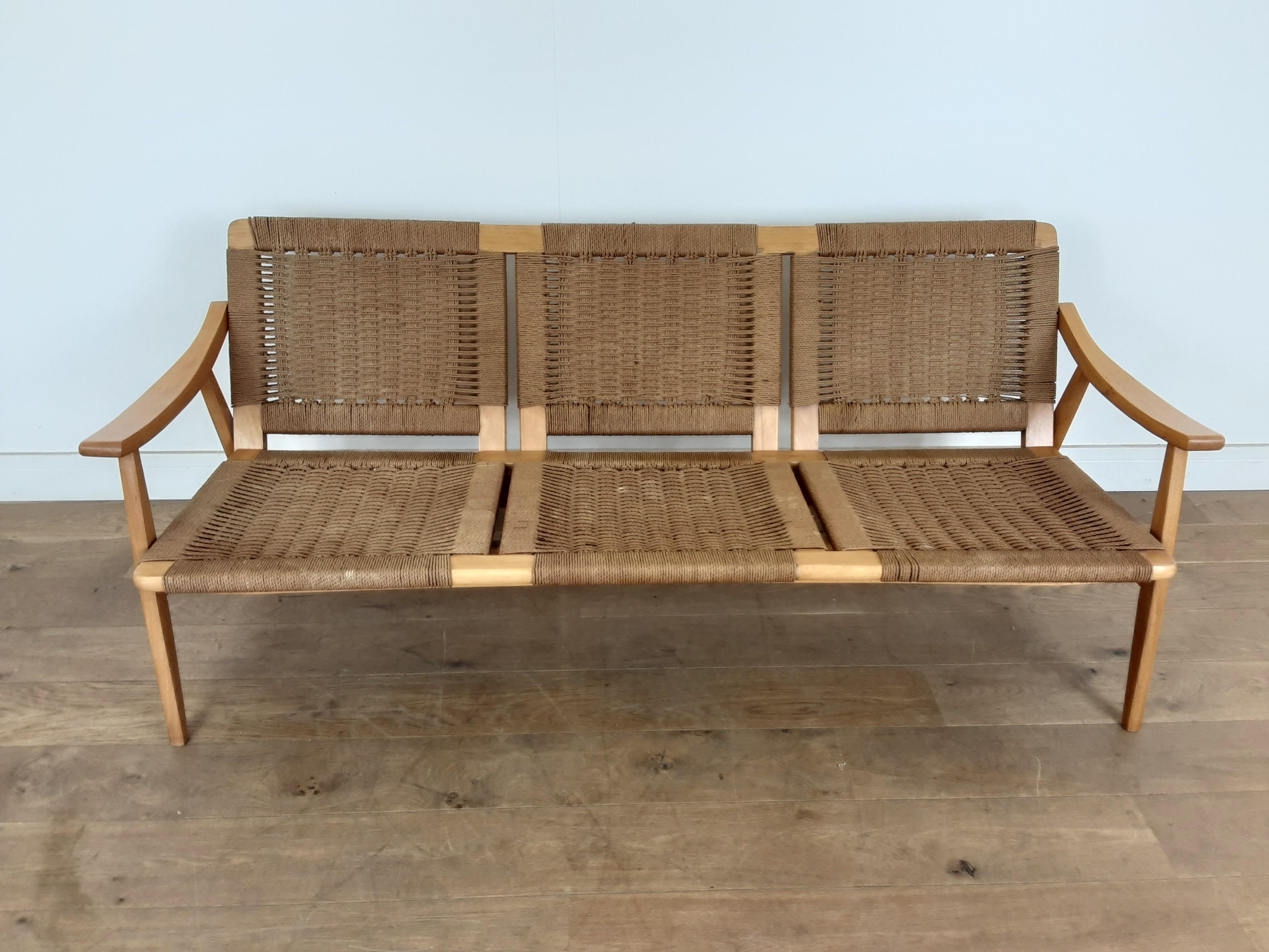 Mid-Century Modern design rattan suite.
Midcentury woven lounge suite with a three-seat sofa and two tilt backed armchairs.
Danish, circa 1960.
Measures: Sofa 71 cm H, 174 cm W, 73 cm D, seat H 37 cm, seat D 50 cm
Armchairs 70 cm H, 66.5 cm W,