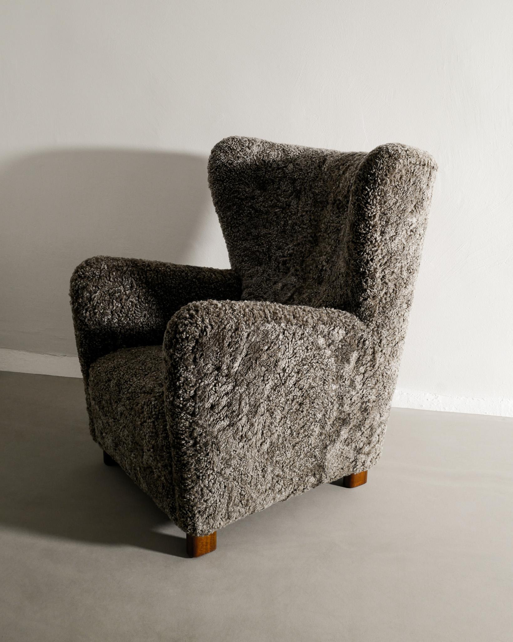 Scandinavian Modern Danish Mid Century Wingback Armchair with Sheepskin Produced in Denmark, 1940s  For Sale