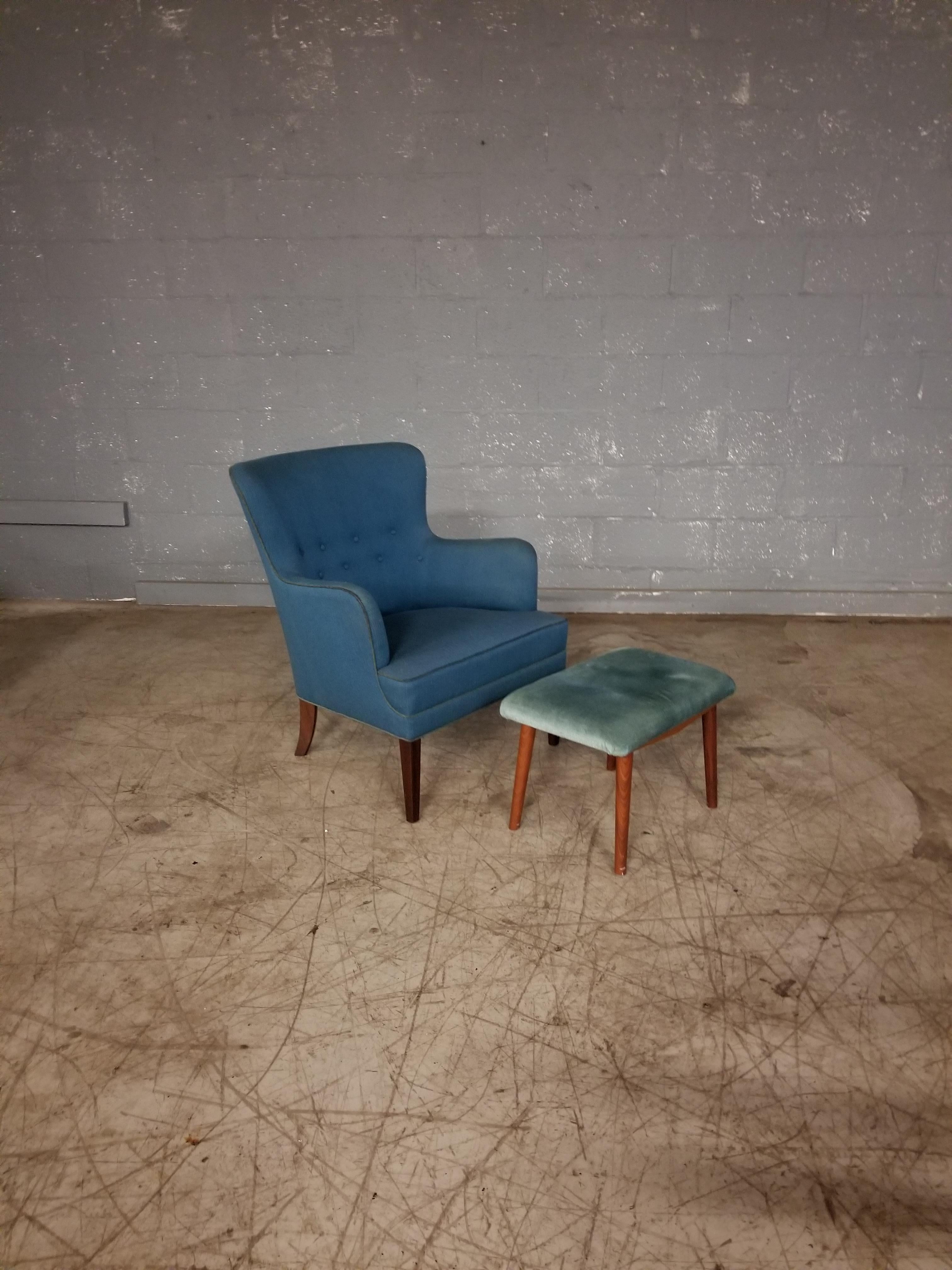Danish footstool made in the 1950's. Made from  beech wood and raised on legs of teak. Sturdy and good condition 

