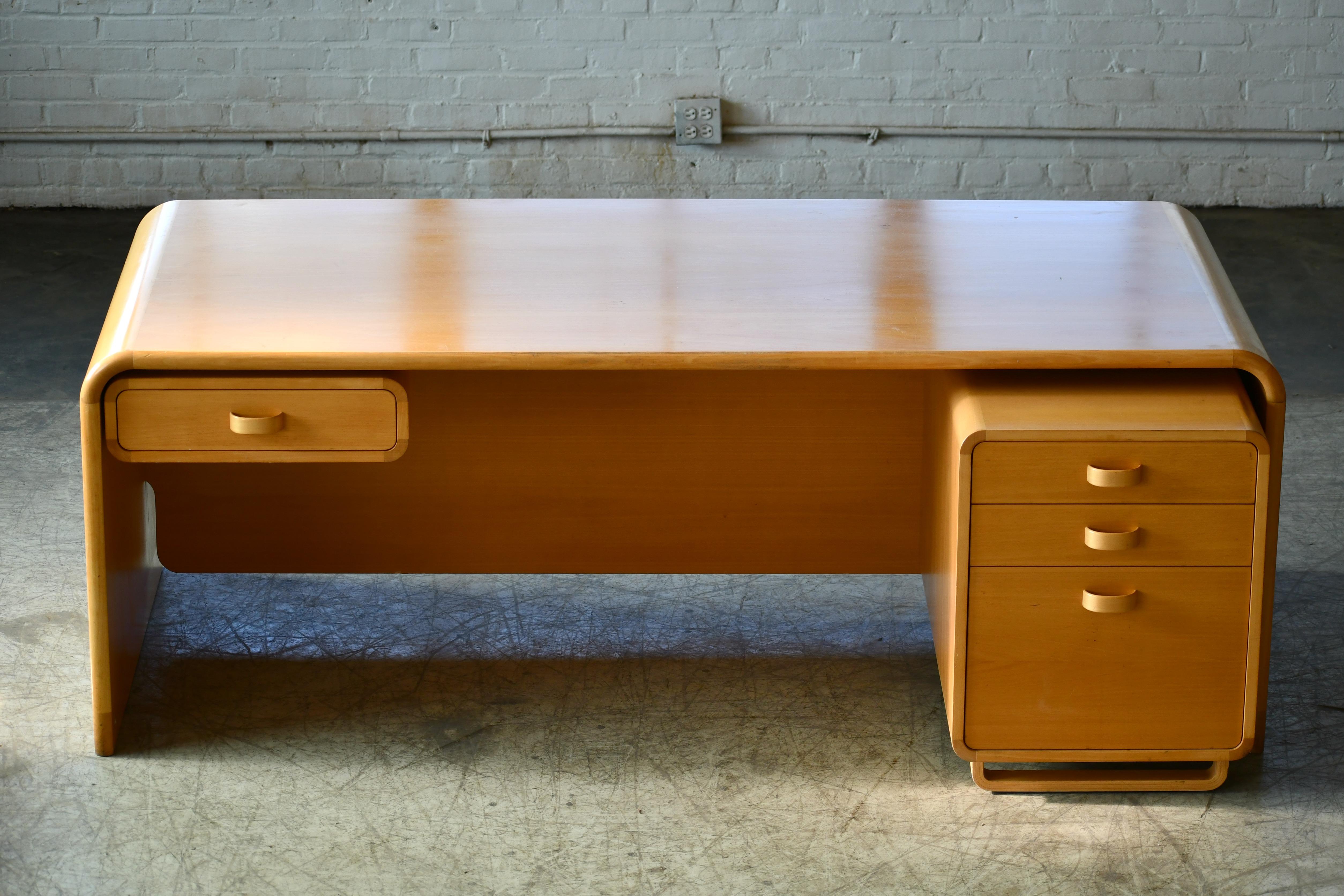 Stunning executive desk designed by Rud Thygesen & Johnny Sørensen with a side drawer and a side drawer module all made in a nice blond birch plywood/veneer. Designed in the late 1960s in a style way ahead of its time which was typical for many of