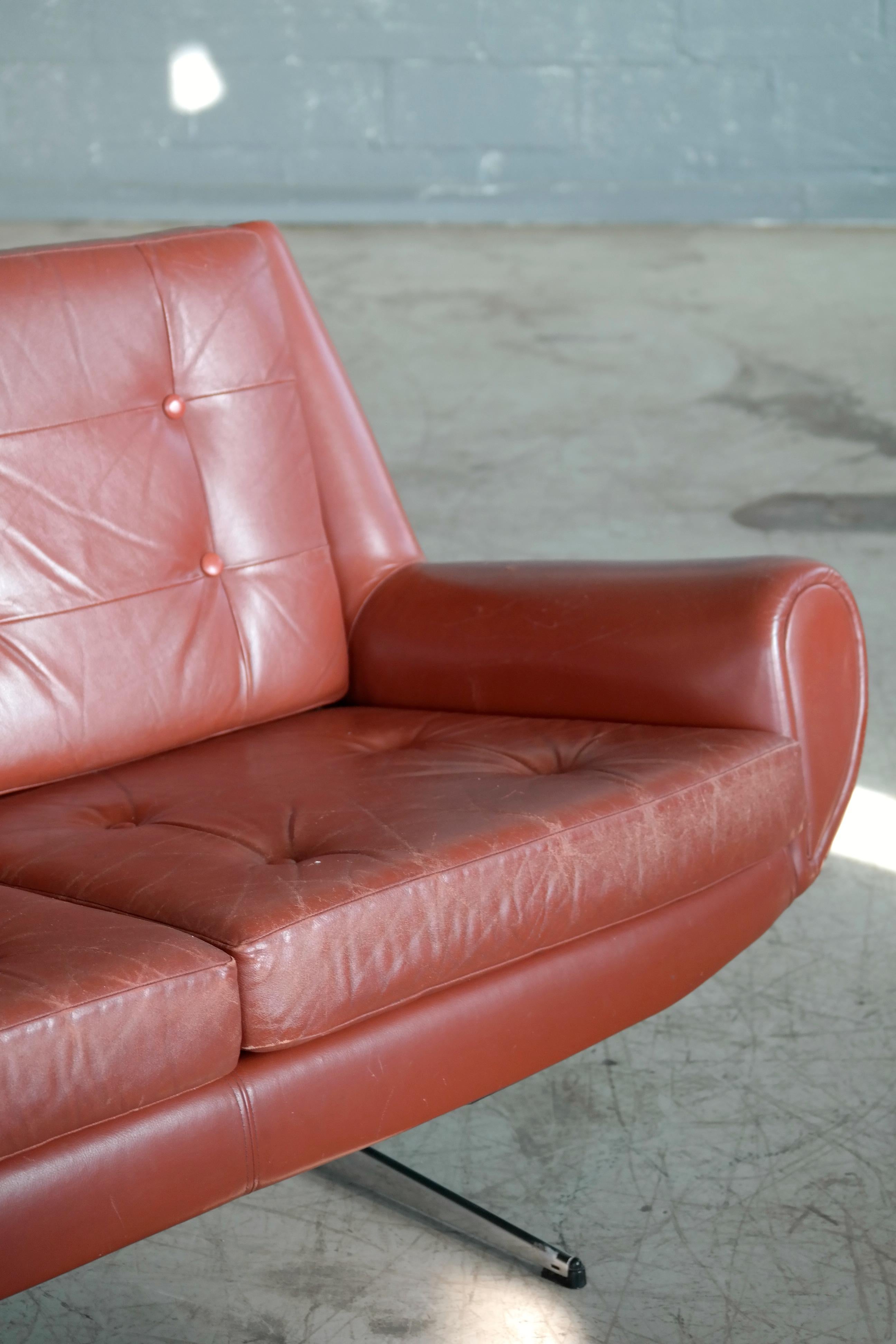 leather couch with metal legs