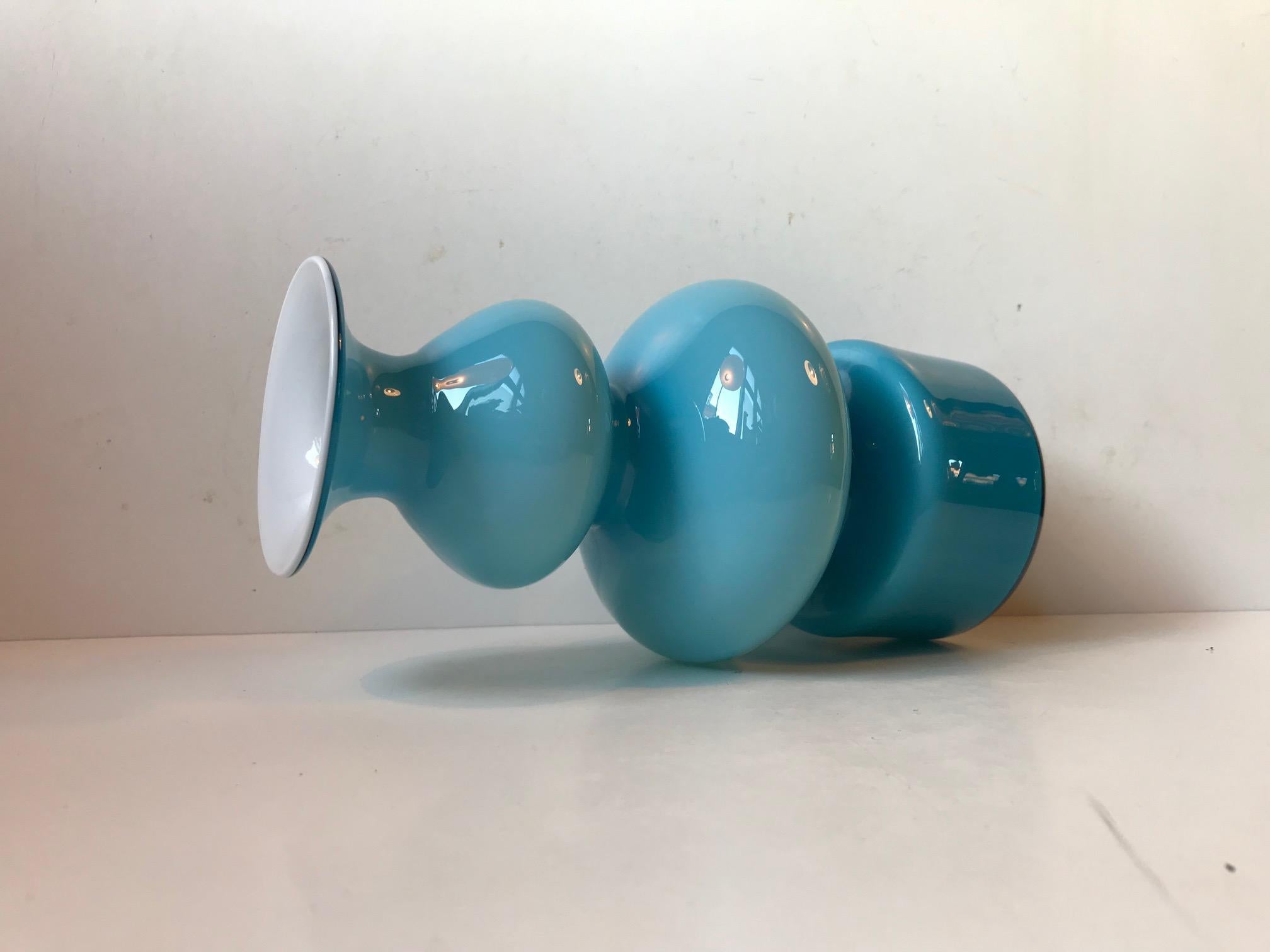 Cased light blue opaline glass vase designed by Per Lütken in 1968 and manufactured by Holmegaard in Denmark until 1976. This color and size in the Carnaby/Palet series is the most sought after.