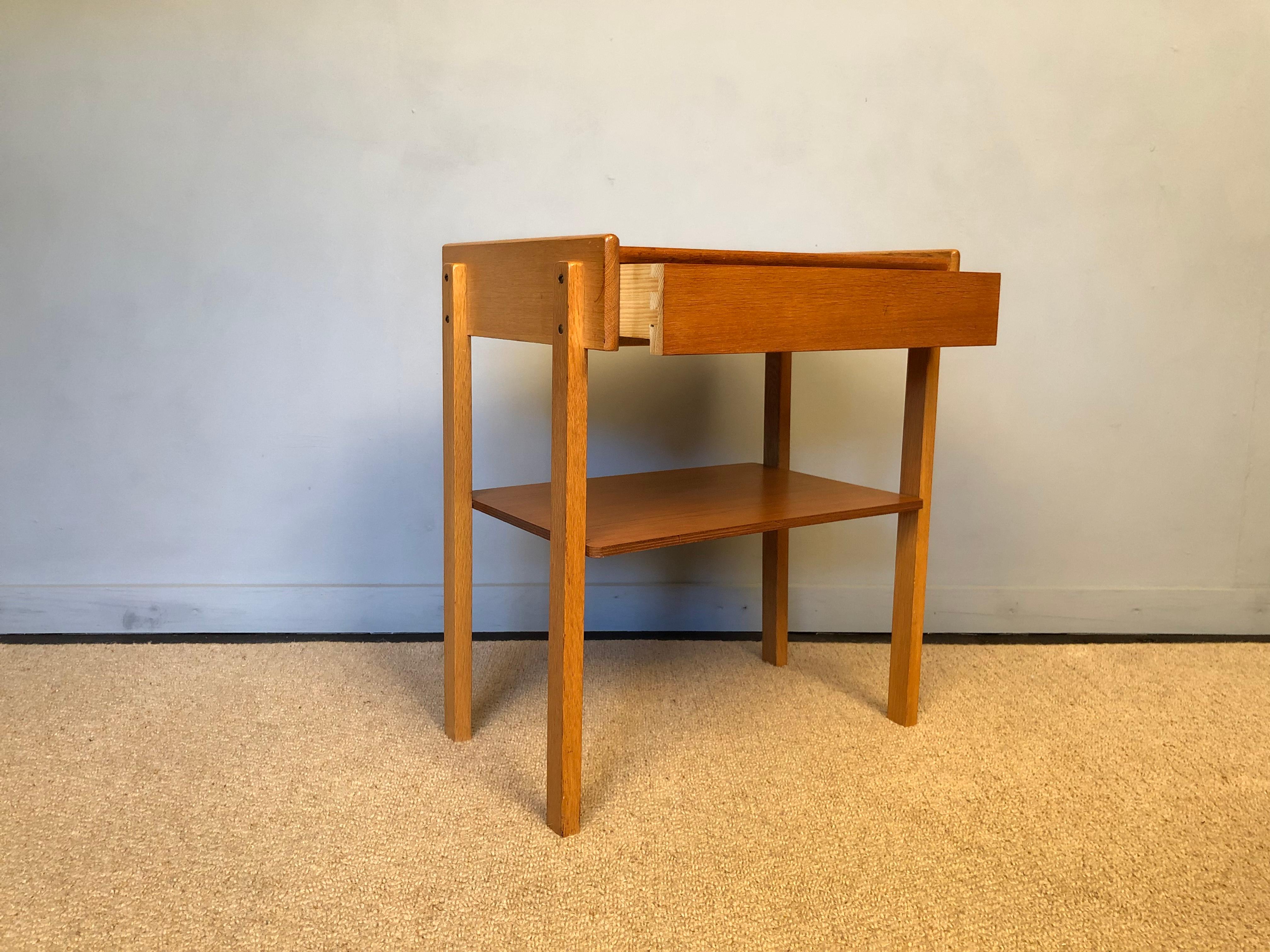 Pair of Danish midcentury nightstands/end tables produced, circa 1960. Made from oak and teak. Thoroughly cleaned, waxed and polished. 
Nice Scandinavia minimalist  design. 