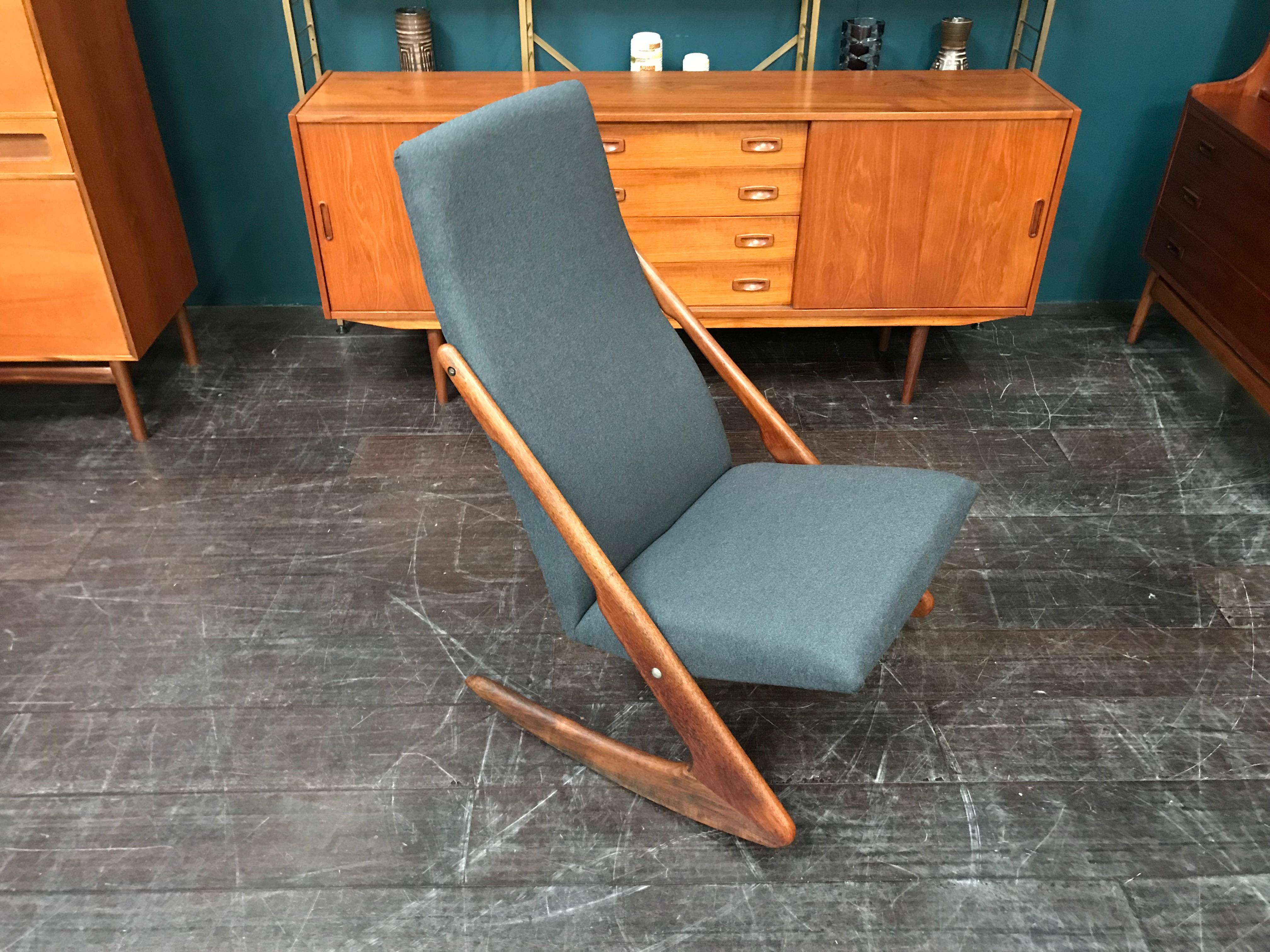 An iconic ‘Boomerang’ chair by Danish manufacturer Mogens Kold. This vintage midcentury chair was designed in the late 1950s. The solid teak ‘skids’ are integrated into the frame, giving the chair a gorgeous retro look.

Danish furniture maker