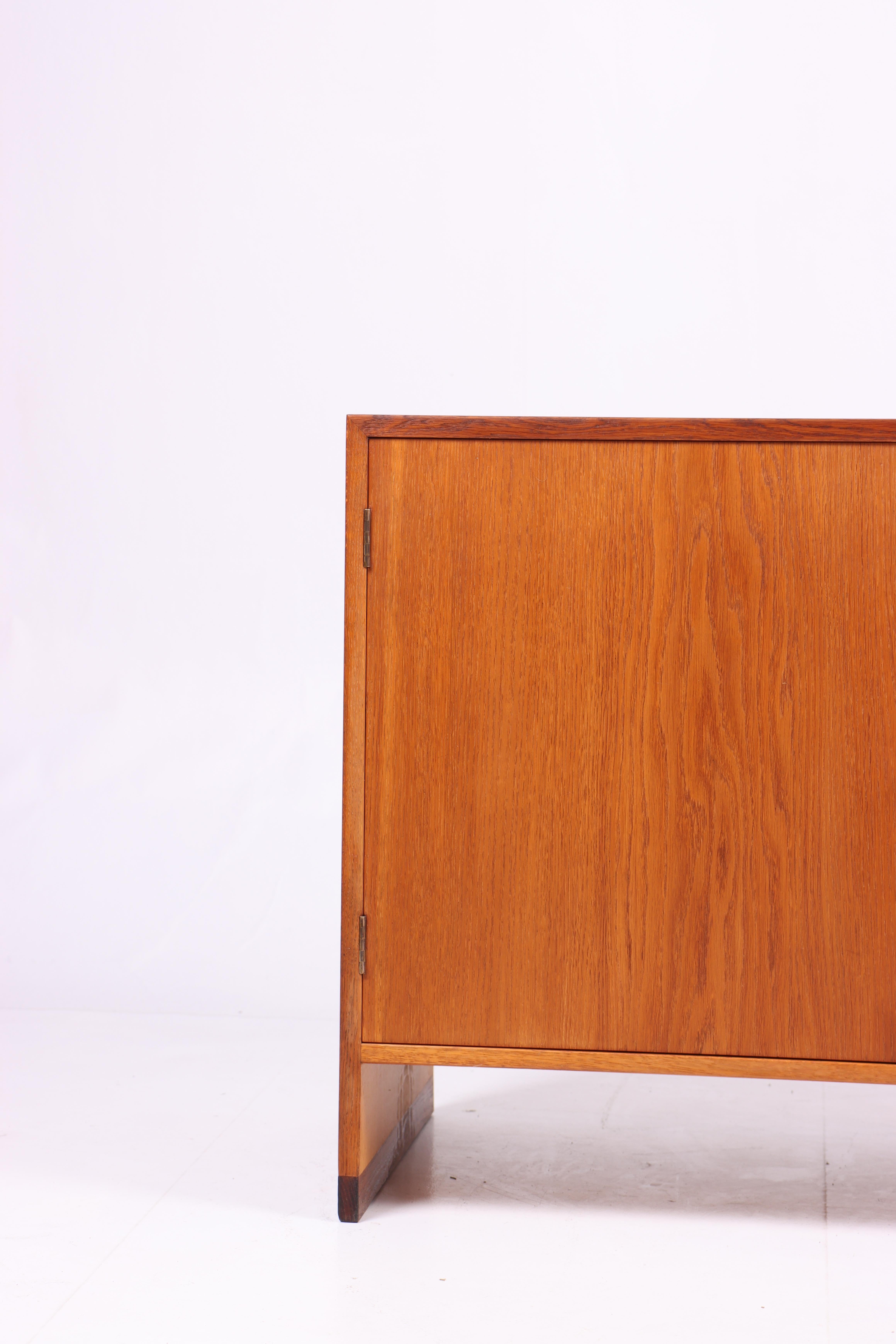 Cabinet in oak. Designed by Hans J Wegner for RY Moebler cabinetmakers in the late 1950s.